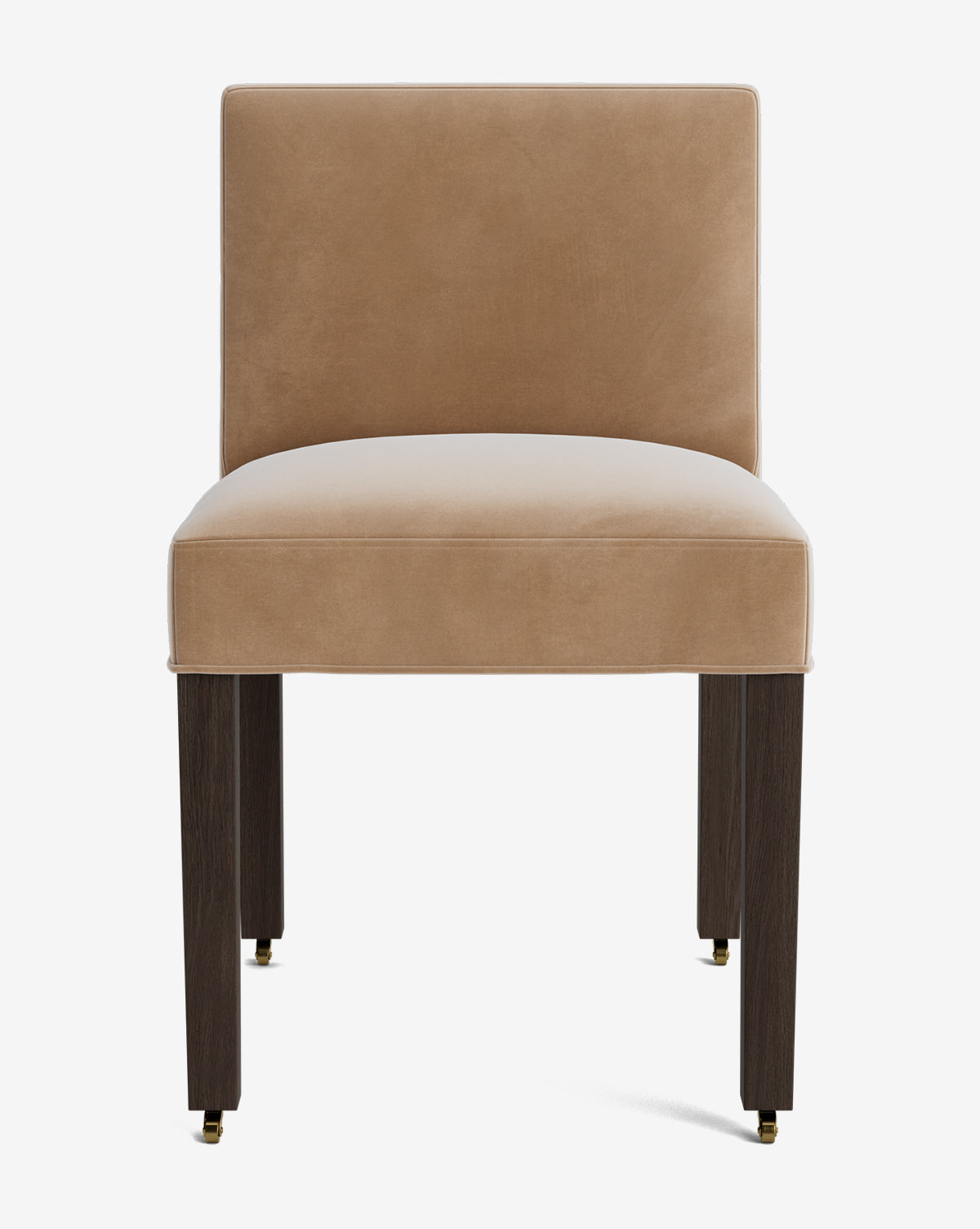 The Olivier Upholstered Dining Chair features a modern design with a light brown high-quality fabric seat and backrest, dark wooden legs, and small brass casters on the front two legs, all set against a white background by McGee & Co.
