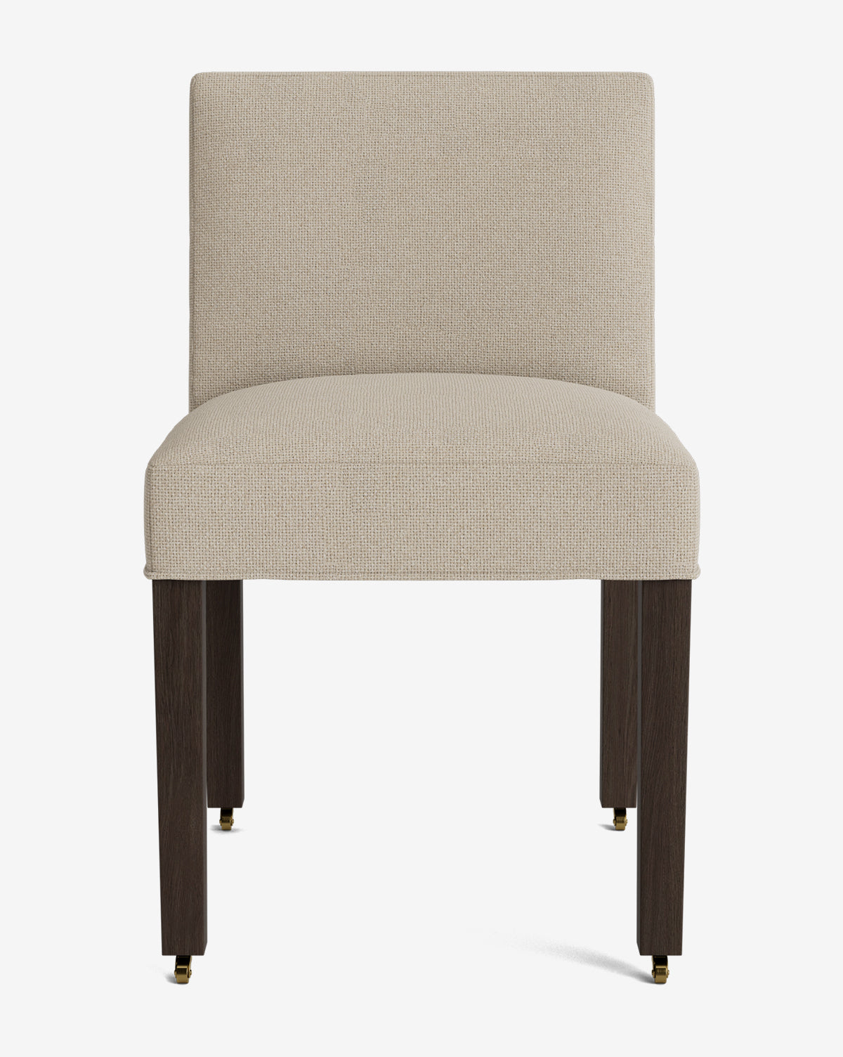 Front view of the Olivier Upholstered Dining Chair featuring a light beige high-quality fabric seat and backrest, straight dark wooden legs, and small brass casters on each leg, by McGee & Co.