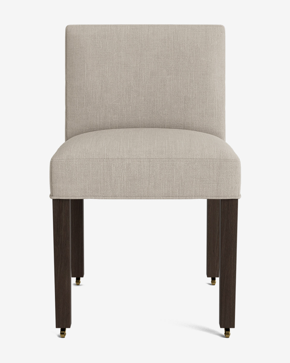 The Olivier Upholstered Dining Chair features a modern design with a light beige fabric seat and backrest, four dark wooden legs with brass-capped feet, and is showcased against a plain white background by McGee & Co.