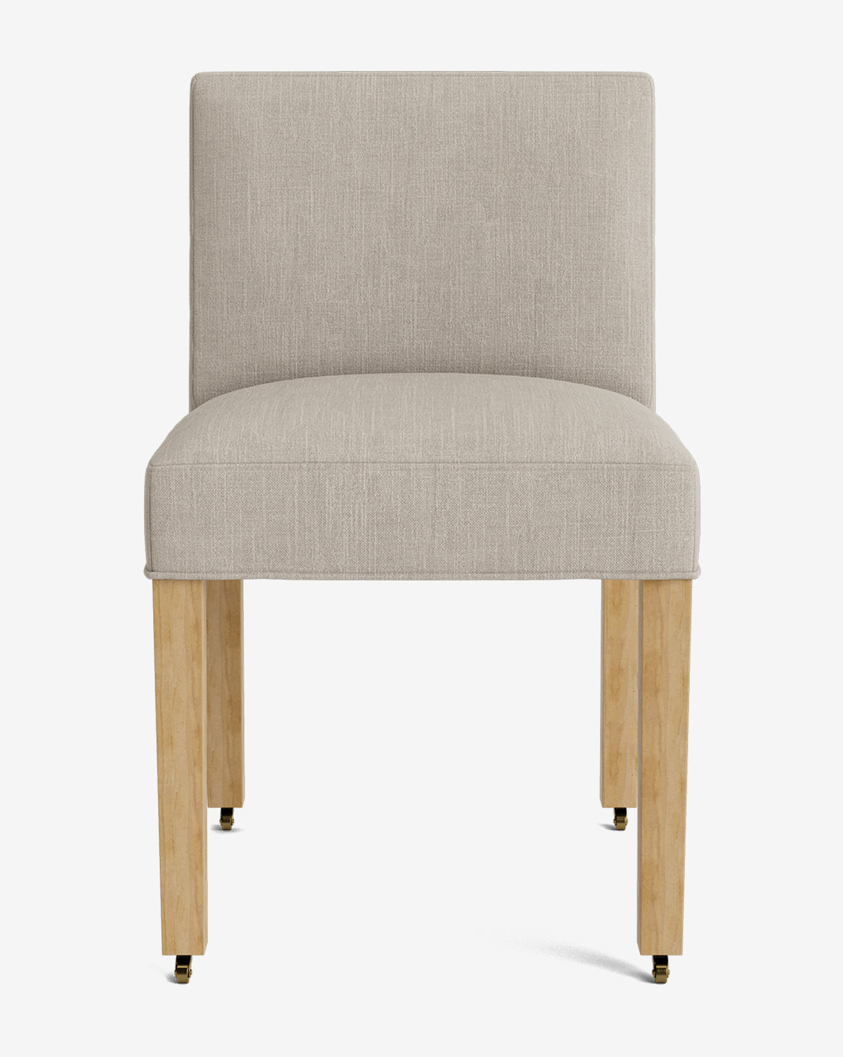 The Olivier Upholstered Dining Chair features a modern armless design, high-quality light beige fabric, straight backrest, wooden legs, and front brass casters, all set against a plain white background by McGee & Co.