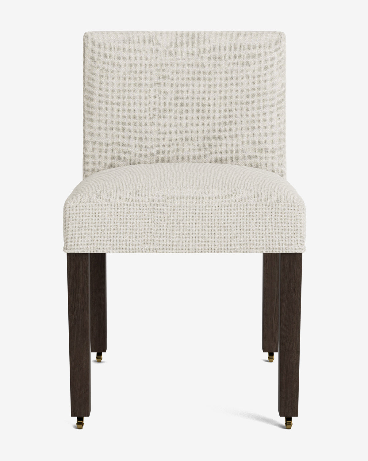 The Olivier Upholstered Dining Chair features a cream, high-quality fabric seat and backrest, four dark wooden legs, and small brass casters on the two front legs for a modern touch, by McGee & Co.