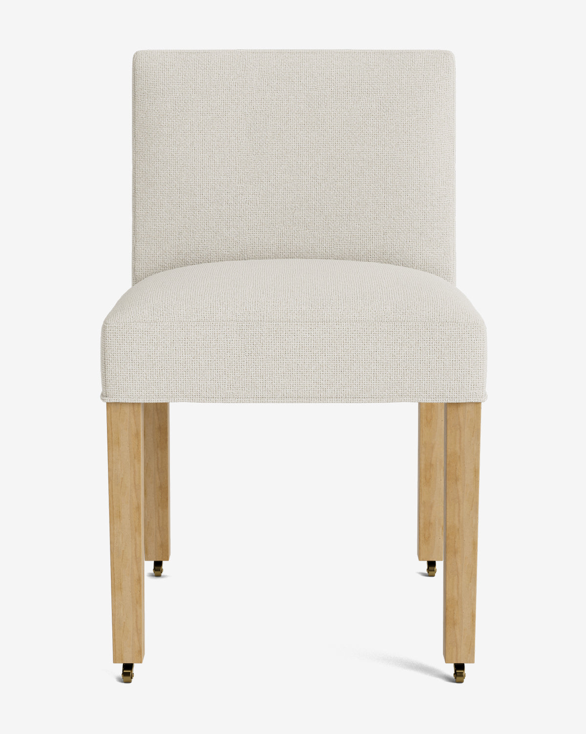Front view of the Olivier Upholstered Dining Chair, featuring a cream-colored fabric seat and backrest, supported by four light wood legs with small casters at the bottom, by McGee & Co.