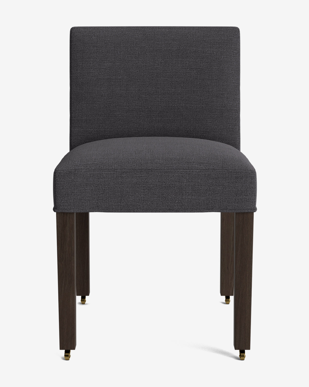 The Olivier Upholstered Dining Chair features a straight, dark grey high-quality fabric seat and back, dark wooden legs, and small brass casters on the front legs, shown against a plain white background by McGee & Co.