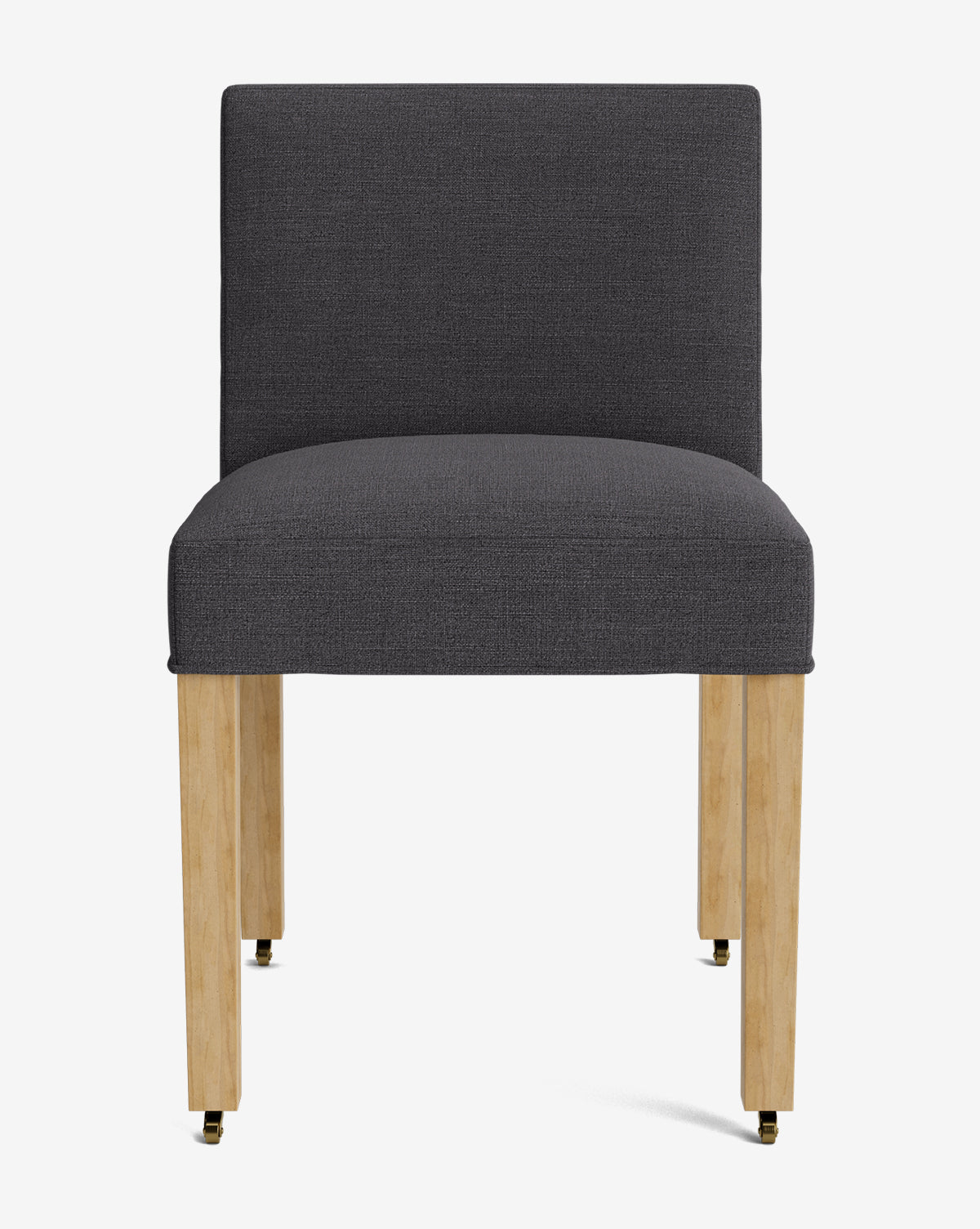 The Olivier Upholstered Dining Chair features a modern design with a dark gray, high-quality fabric seat and backrest, supported by four light wood legs with brass-colored caps, by McGee & Co. It is displayed against a plain white background.