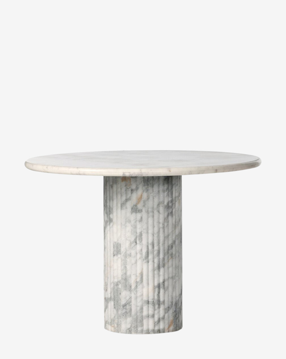 The Patrick Dining Table features a round white marble top with light gray veining and a thick cylindrical base, showcasing refined Italian design, set against a plain white background by McGee & Co.