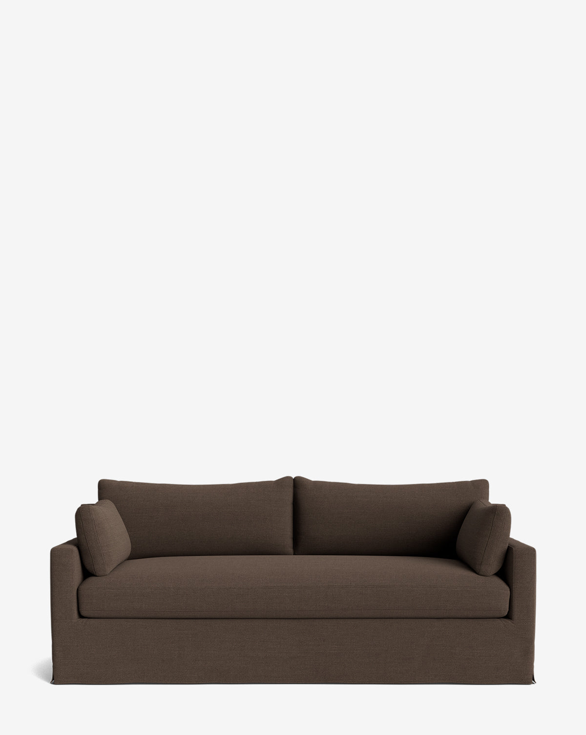 The Peterson Classic Slipcover Sofa (75-100) is a dark brown two-seater with straight arms and two matching cylindrical feather blend cushions, displayed against a plain white background by McGee & Co.