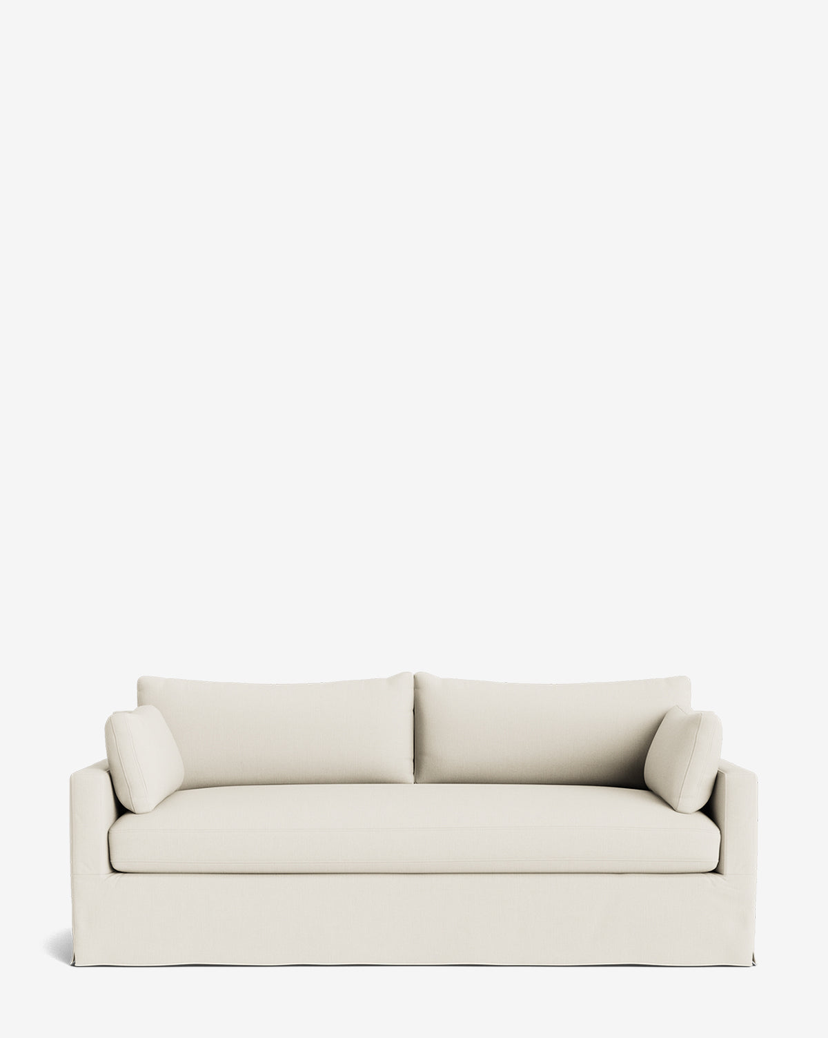 A Peterson Classic Slipcover Sofa (75-100) in modern off-white, featuring clean lines, two seat cushions, feather blend fill, and two cylindrical side pillows is displayed against a plain white background by McGee & Co.