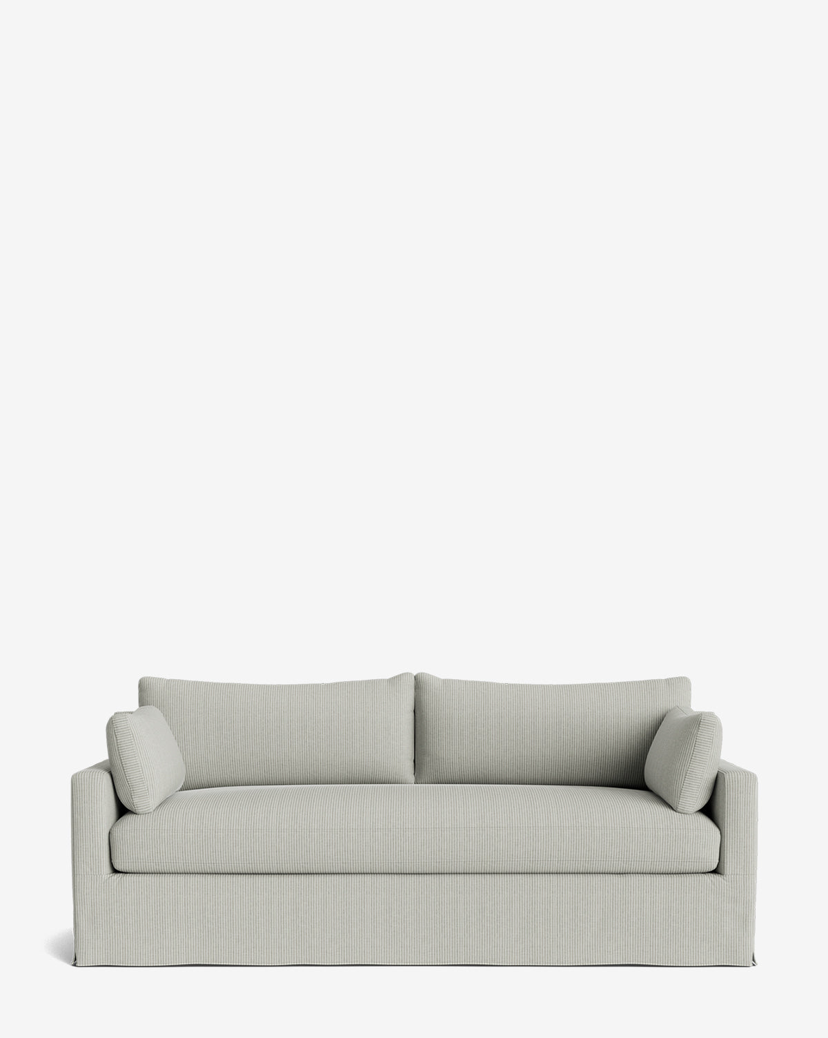 The Peterson Classic Slipcover Sofa (75-100) showcases light gray upholstery, feather blend seat and back cushions, two cylindrical arm pillows, all displayed on a plain white background by McGee & Co.
