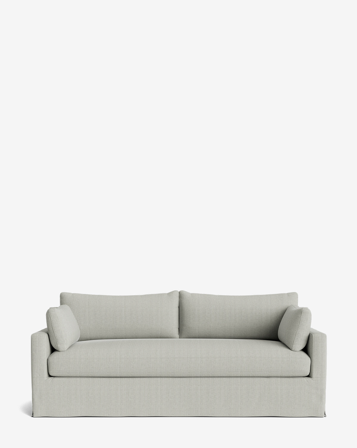 The Peterson Classic Slipcover Sofa (75-100) in light gray features two seat and back cushions, two cylindrical bolster pillows, and feather blend cushions for comfort, all in a simple modern design on a plain white background by McGee & Co.