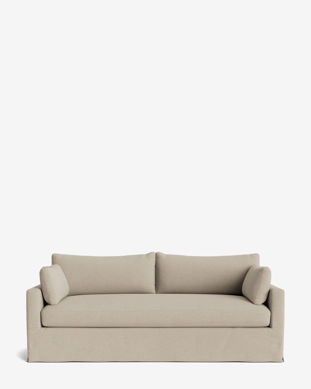 A beige Peterson Classic Slipcover Sofa (75-100) with straight arms, two feather blend back cushions, and two cylindrical side pillows is set against a plain white background by McGee & Co.