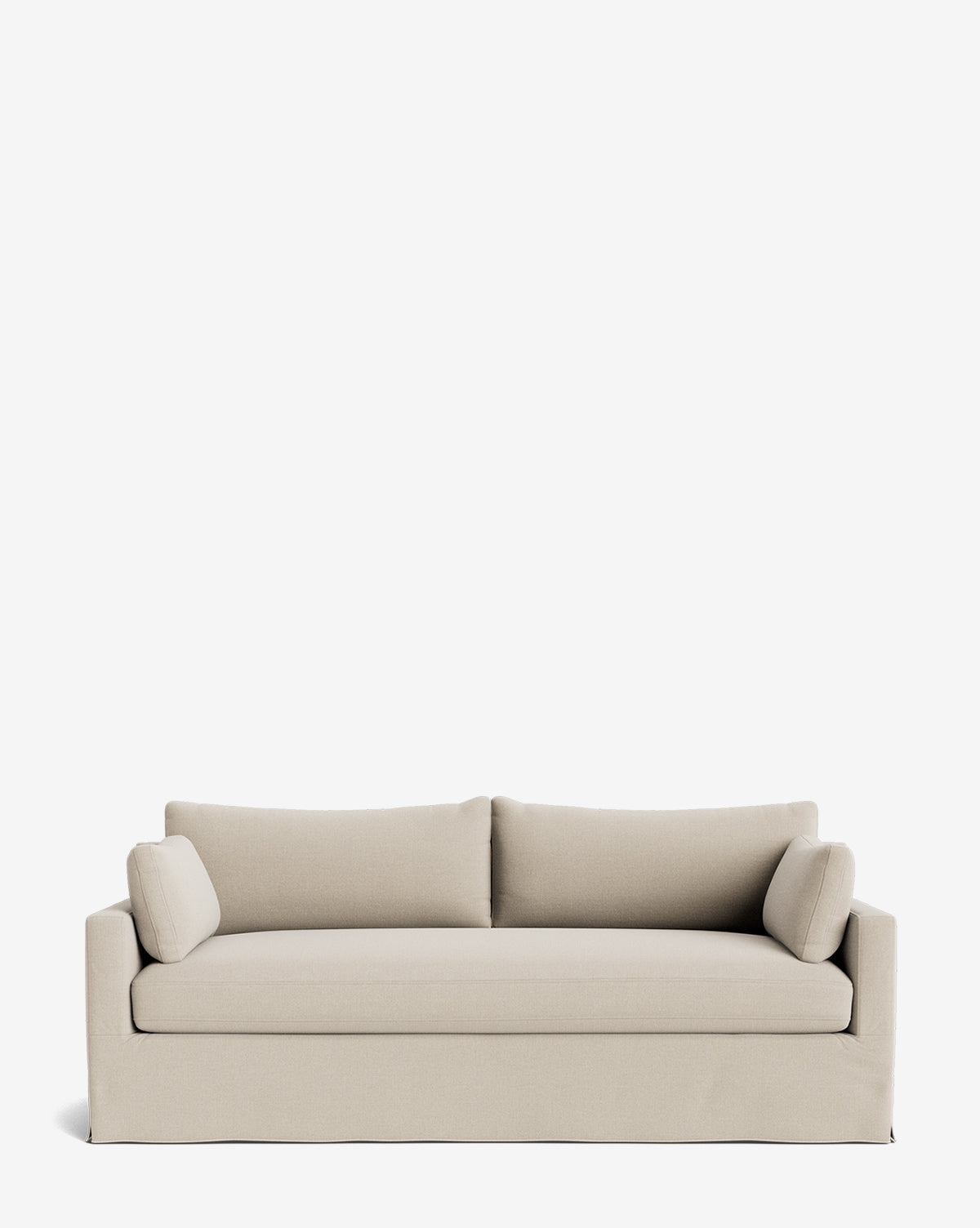 A Peterson Classic Slipcover Sofa (75-100) in modern beige, featuring clean lines, feather blend cushions, and two cylindrical bolster pillows, set against a plain white background by McGee & Co.
