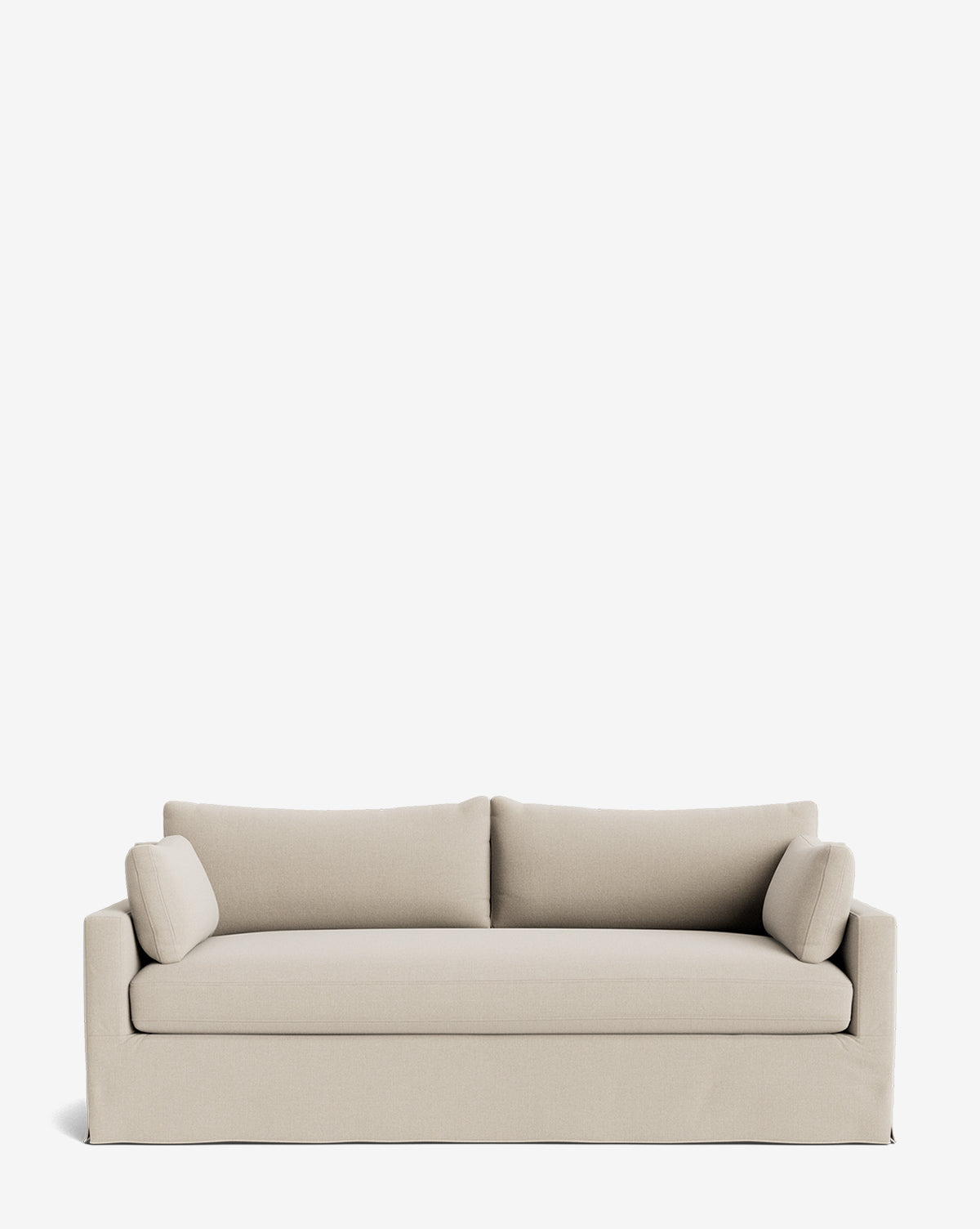 The Peterson Classic Slipcover Sofa (75-100) in light beige features feather blend cushions, two seat and back cushions, and two small cylindrical side pillows, all set against a plain white background for a modern look, by McGee & Co.
