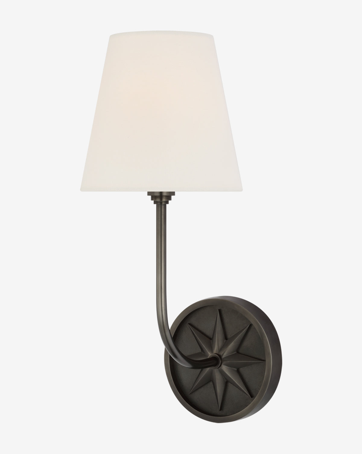 The Polaris Sconce by Visual Comfort & Co. Signature is a wall-mounted light with a black circular base featuring an embossed star, a curved metal arm, and a conical white linen shade, available at McGee & Co.