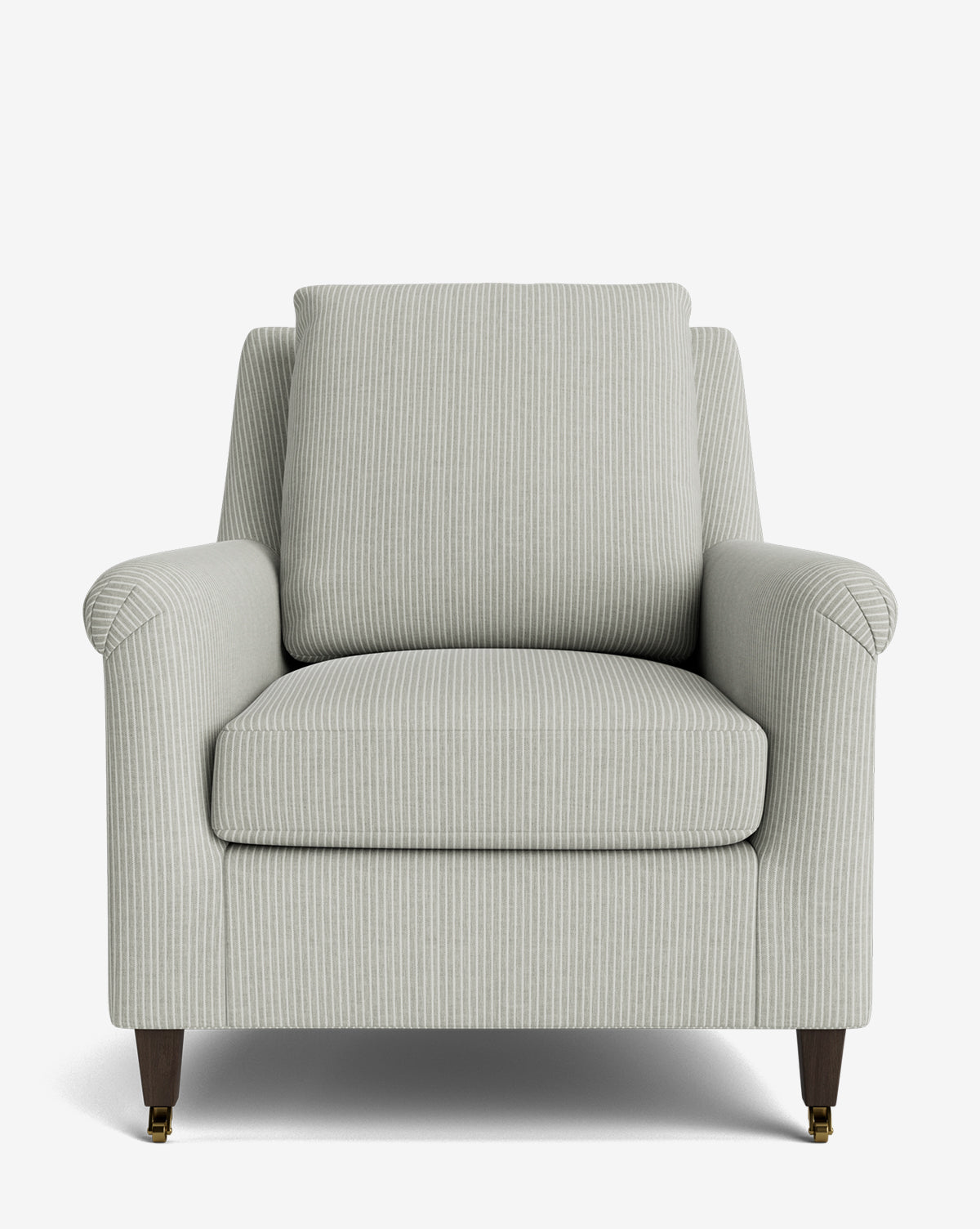 The Reedley Lounge Chair is a light gray upholstered luxury chair with subtle vertical stripes, angled armrests, cushioned seat and backrest, and four wooden legs—two featuring brass-colored castors—set against a white background by McGee & Co.