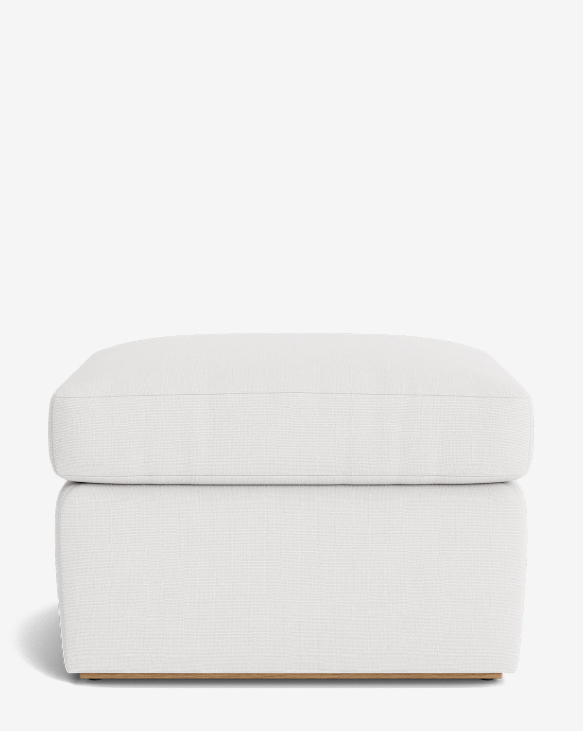 The Reese Ottoman is a modern, handcrafted piece with a rectangular shape, minimalistic design, and down-wrapped cushion, shown on a plain white background by McGee & Co.