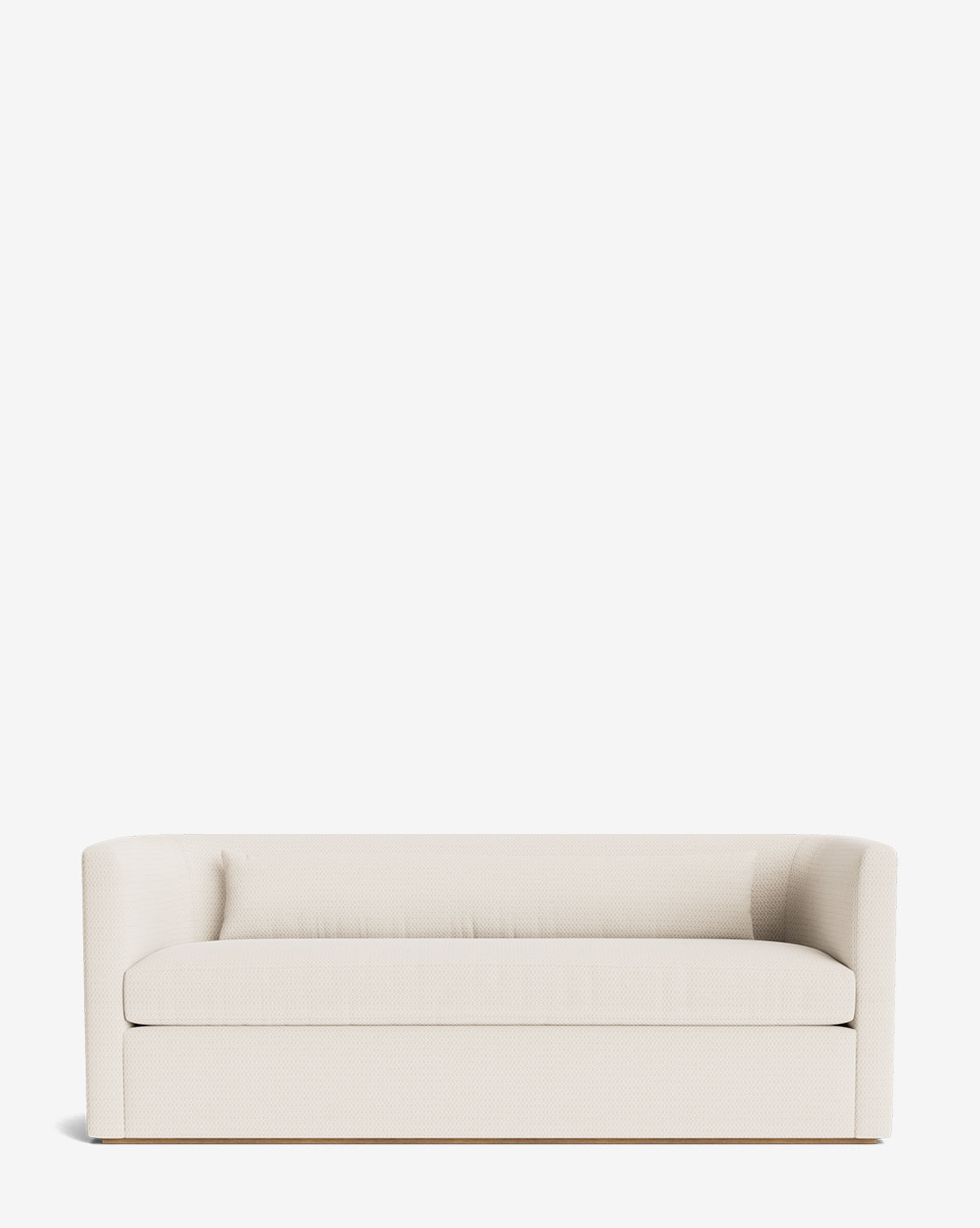 The Reese Sofa (84-96) showcases a modern, minimalist look with off-white upholstery, rounded arms, and a low back. Handcrafted alder wood frame and down-wrapped cushions provide both durability and comfort against a white backdrop, by McGee & Co.