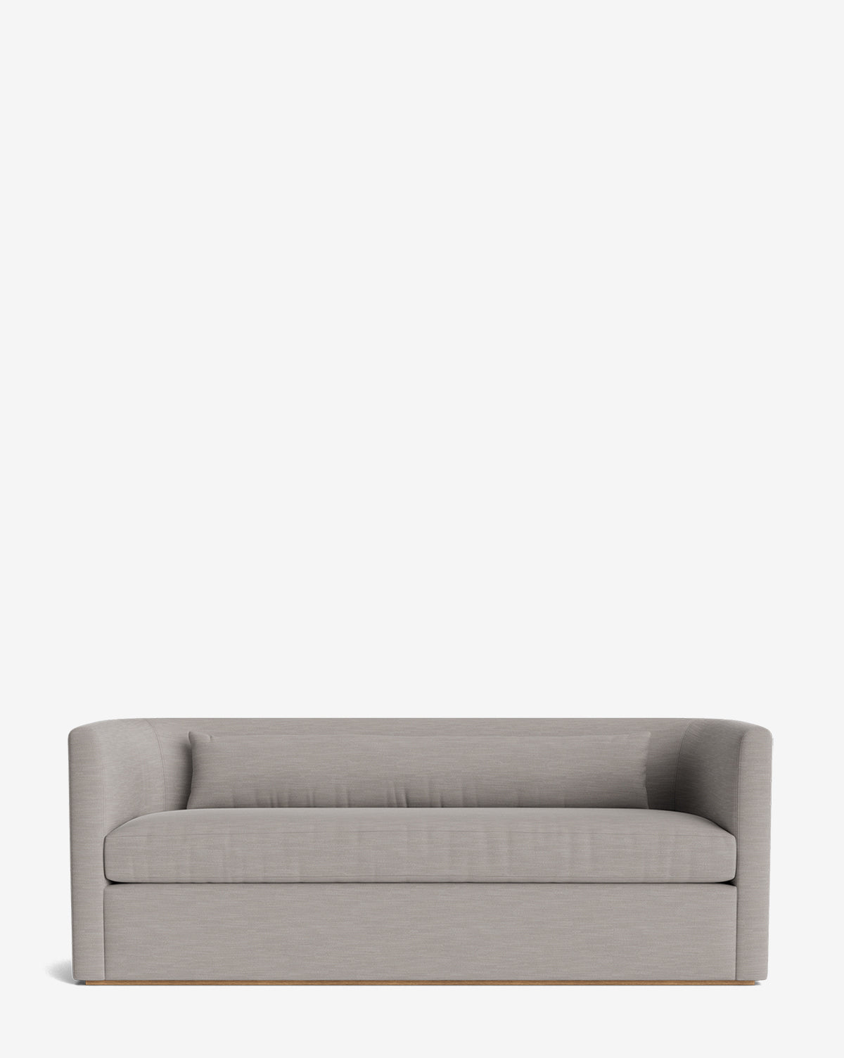 The Reese Sofa (84-96) showcases a modern, light gray upholstered design with a low back and arms, a single down-wrapped cushion, and a minimalist alder wood base, photographed against a plain white background, by McGee & Co.