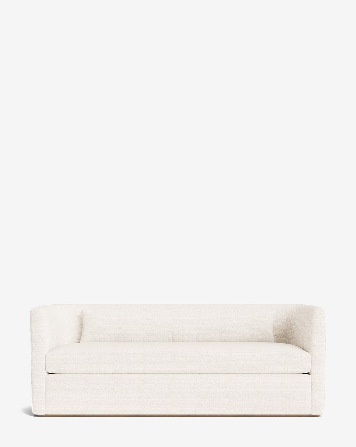 The Reese Sofa (84-96) in cream features curved armrests, down-wrapped cushions on a smooth seat, and handcrafted alder wood legs, set against a plain white background by McGee & Co.