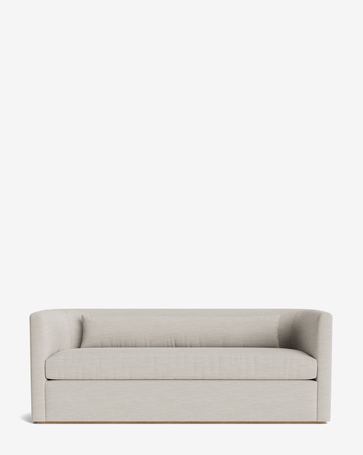 The Reese Sofa (84-96) features down-wrapped cushions, a modern light gray design with low curved arms, and a simple boxy handcrafted alder wood base, shown against a plain white background by McGee & Co.