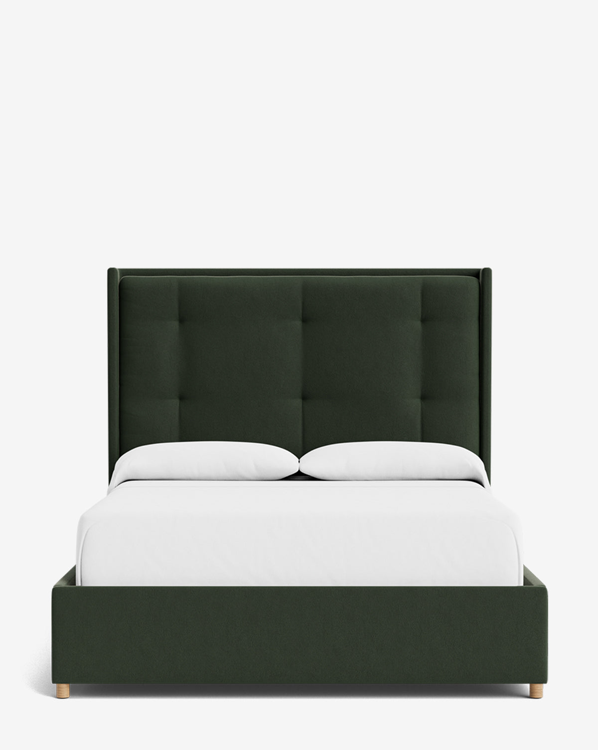 The Ria Bed features a modern dark green upholstered frame, tall tufted headboard, and wooden legs. Shown with white bedding and two pillows against a plain white background. Customizable to match your style, by McGee & Co.
