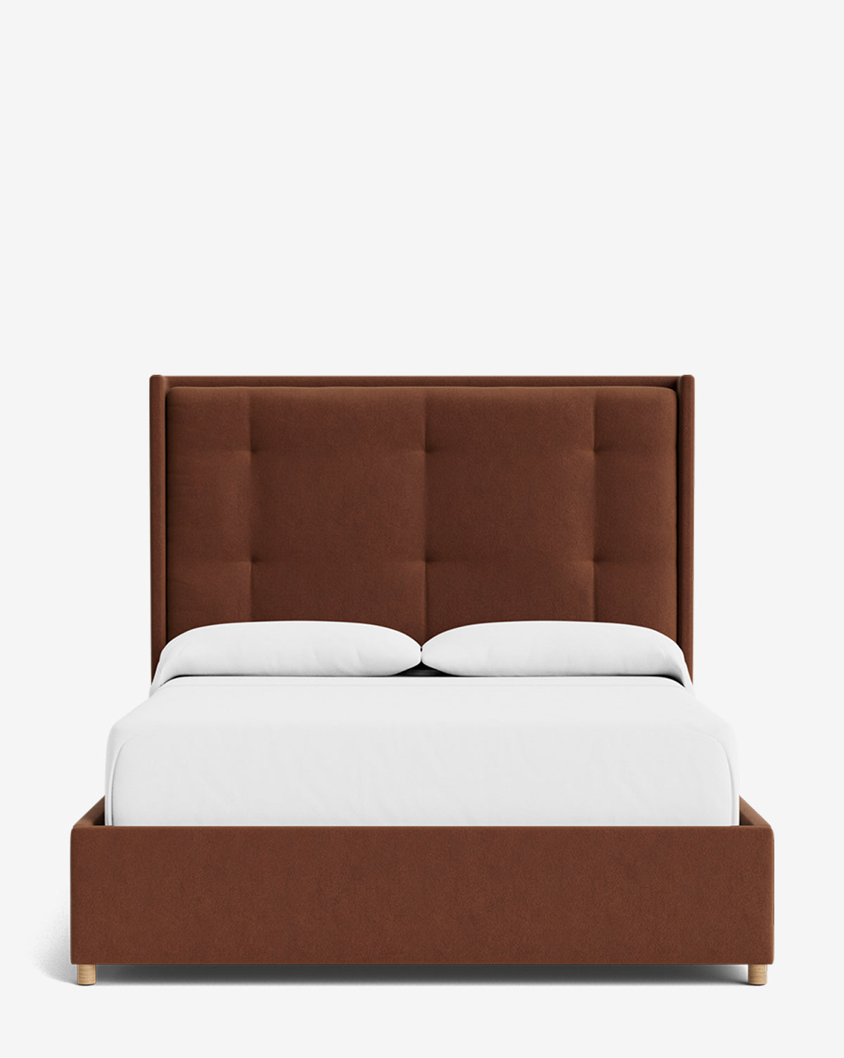 The Ria Bed features a tall brown tufted headboard, white bedding, and a customizable low-profile wooden frame. Shown from the front against a plain white background, it offers modern upholstered elegance for any bedroom, by McGee & Co.