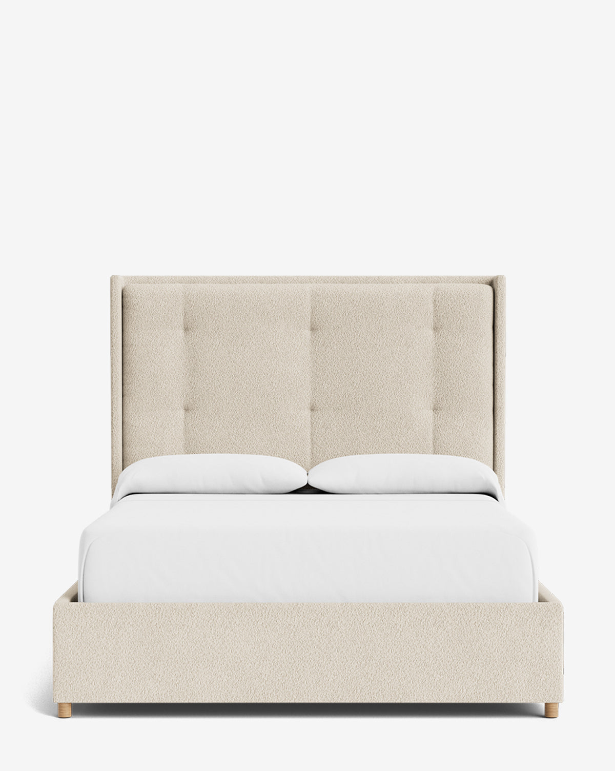 The Ria Bed is a modern, customizable upholstered bed with a tall tufted cream headboard, white bedding, two pillows, and a low-profile wooden base. Its clean, minimalist design stands out against a crisp white background by McGee & Co.