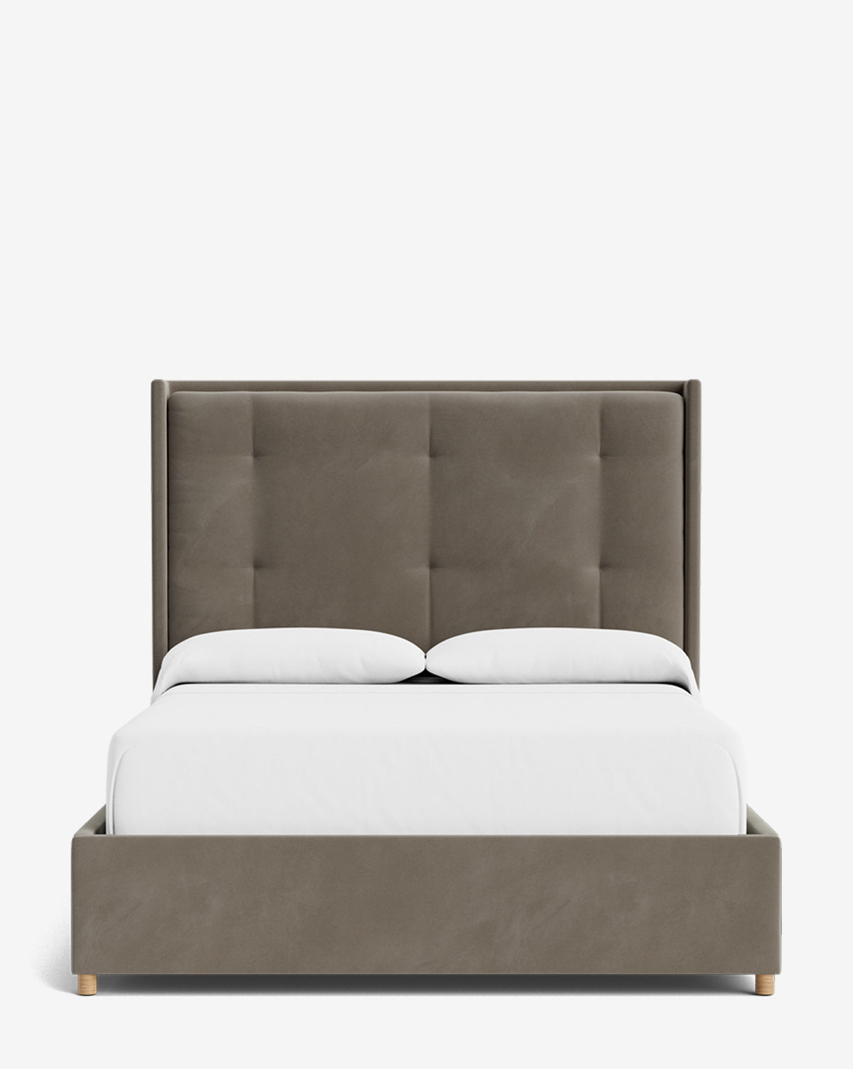 The Ria Bed features a modern upholstered design with a tall, padded, tufted headboard and matching frame. Shown with white sheets and pillows against a white background. Fully customizable to match your style, by McGee & Co.
