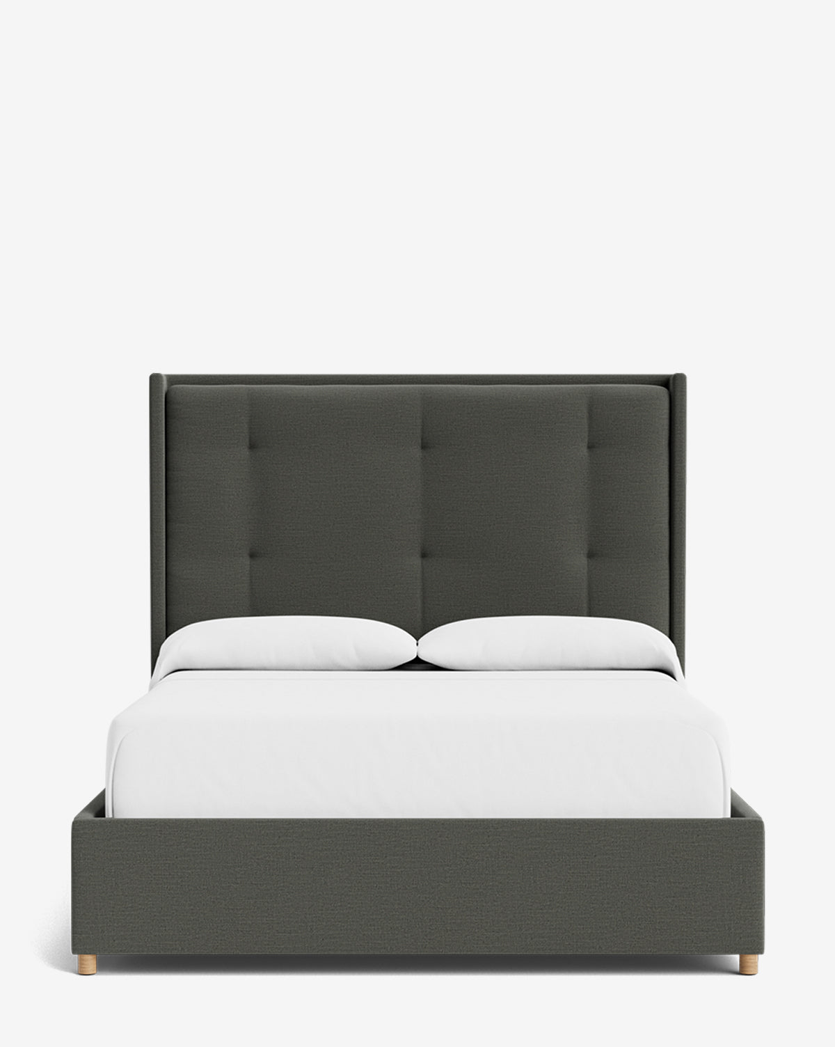 The Ria Bed features a customizable dark gray tufted headboard and frame, paired with crisp white bedding and two white pillows, all set against a plain white background, by McGee & Co.