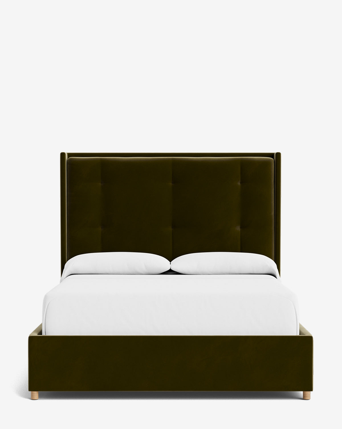 The Ria Bed is a modern, customizable upholstered bed in dark green with a tall tufted headboard, white bedding, and light wooden legs, displayed against a plain white background by McGee & Co.