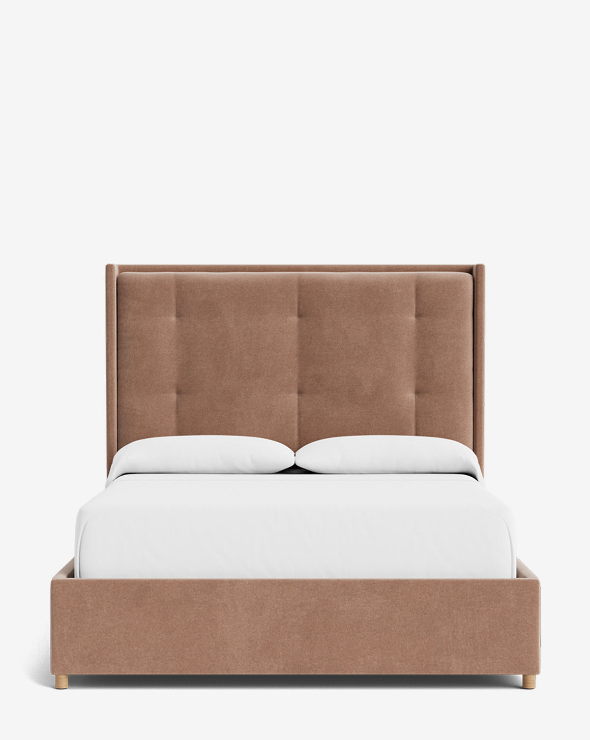 The Ria Bed is a modern upholstered bed with a tall, padded, light brown tufted headboard and frame, shown from the front with white bedding and two pillows against a plain white background by McGee & Co.