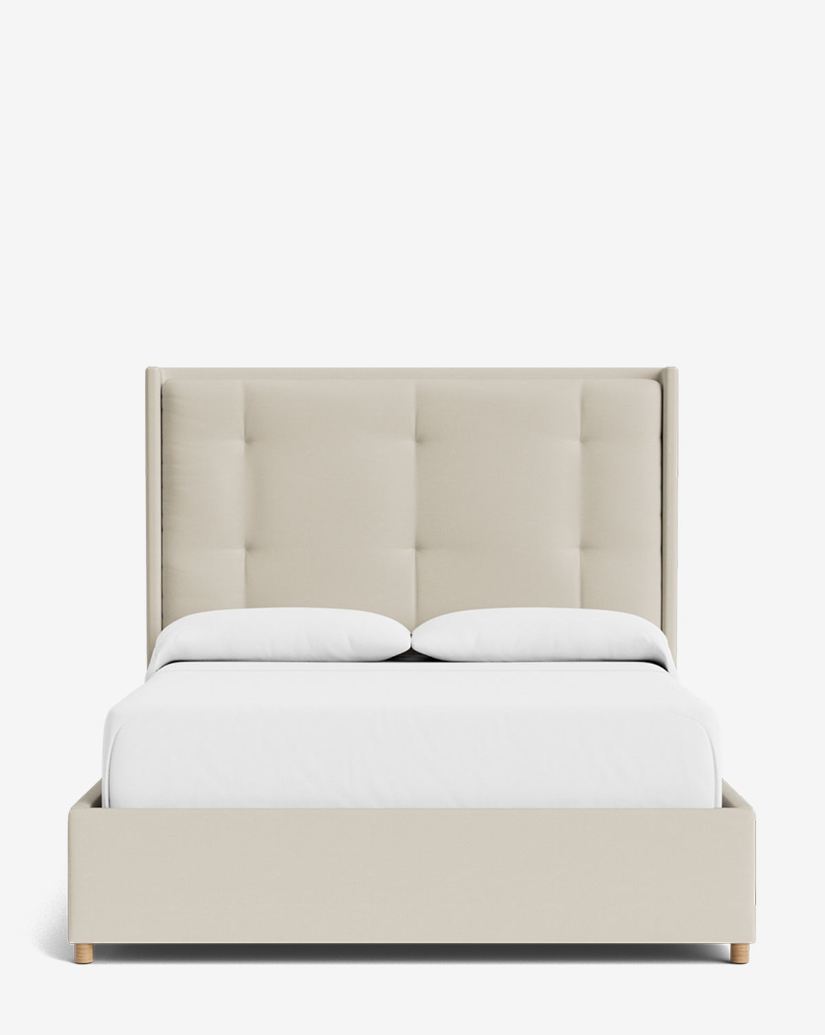 The Ria Bed features modern light beige upholstery with a customizable tall tufted headboard, white bedding, and two pillows, displayed against a plain white background by McGee & Co.
