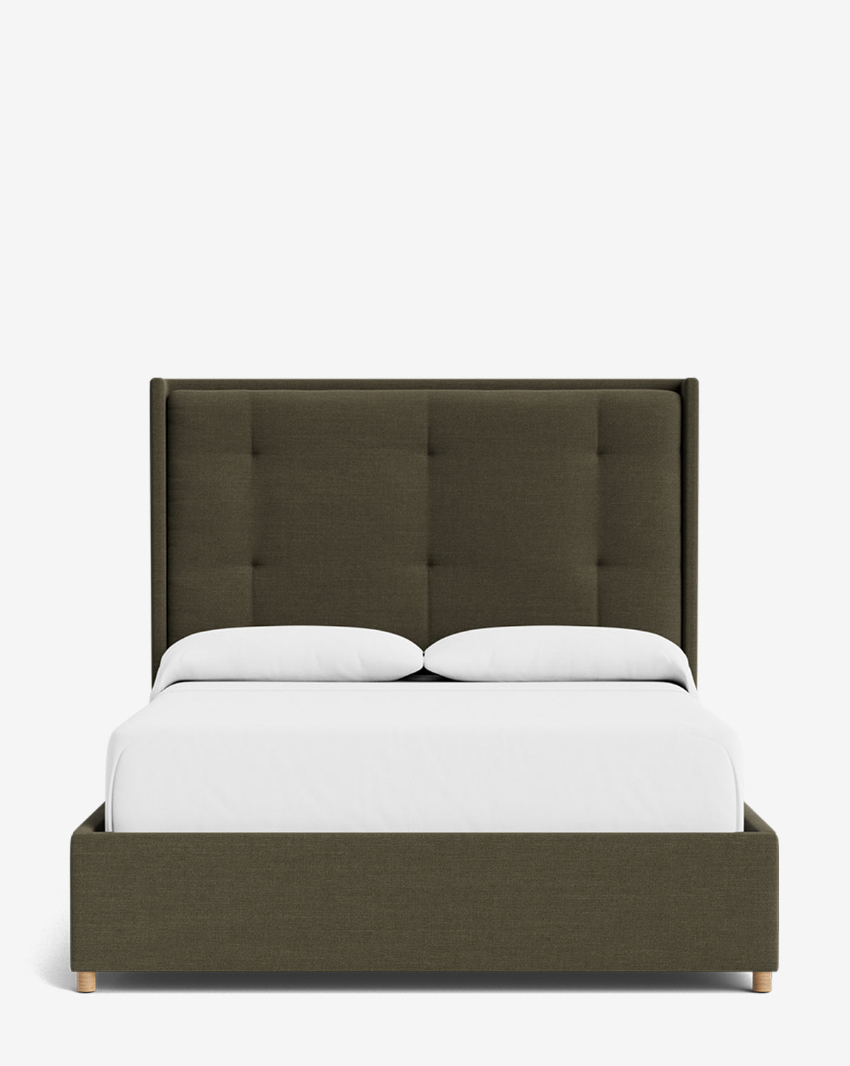 The Ria Bed features a tall, dark olive green tufted headboard, crisp white bedding, and two white pillows, all set against a plain white background. This modern upholstered bed is customizable to suit your style, by McGee & Co.