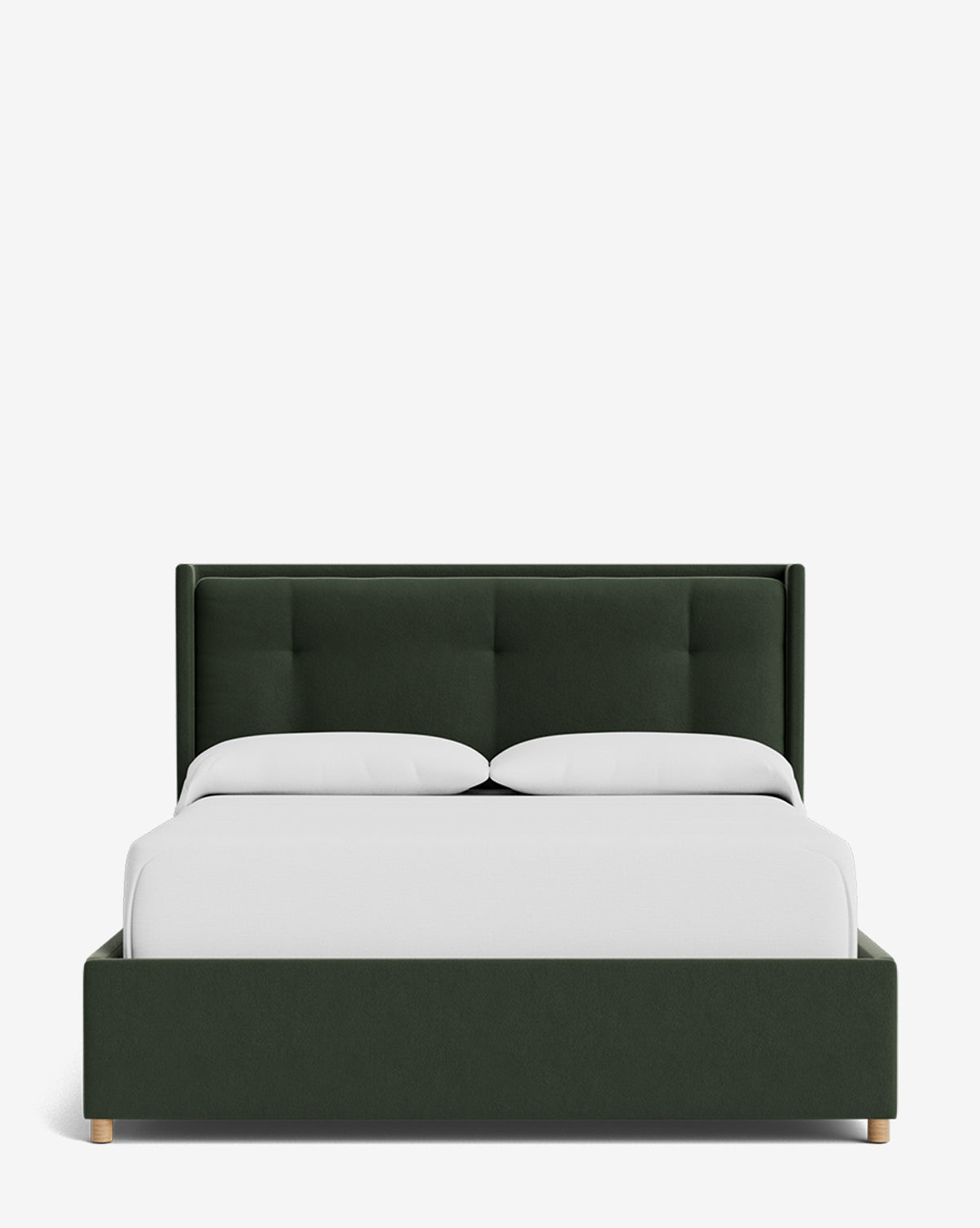 The Ria Bed Low Headboard is a modern dark green upholstered bed with a tufted headboard, neatly dressed in white bedding and two white pillows, shown against a plain white background, by McGee & Co.