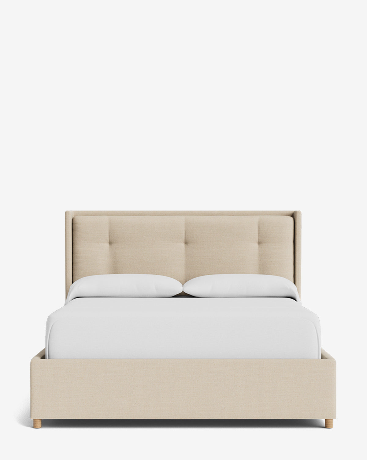 The Ria Bed Low Headboard is displayed from the front, featuring beige upholstery with a tufted headboard, complemented by white pillows and a white comforter, set against a white background, by McGee & Co.