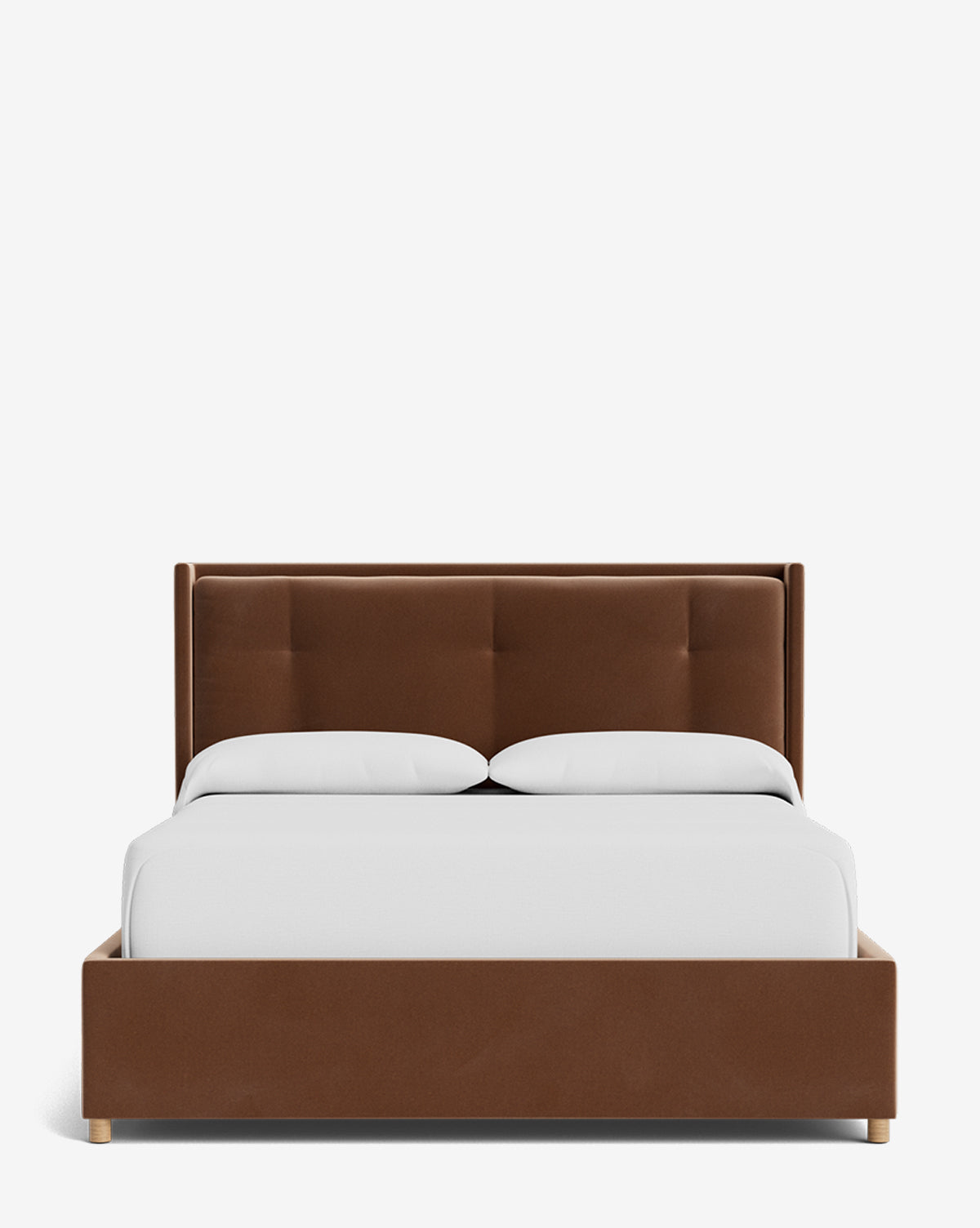 The Ria Bed Low Headboard displays a brown upholstered frame with a tufted headboard, dressed in white bedding and two white pillows, shown from the front on a plain white background by McGee & Co.