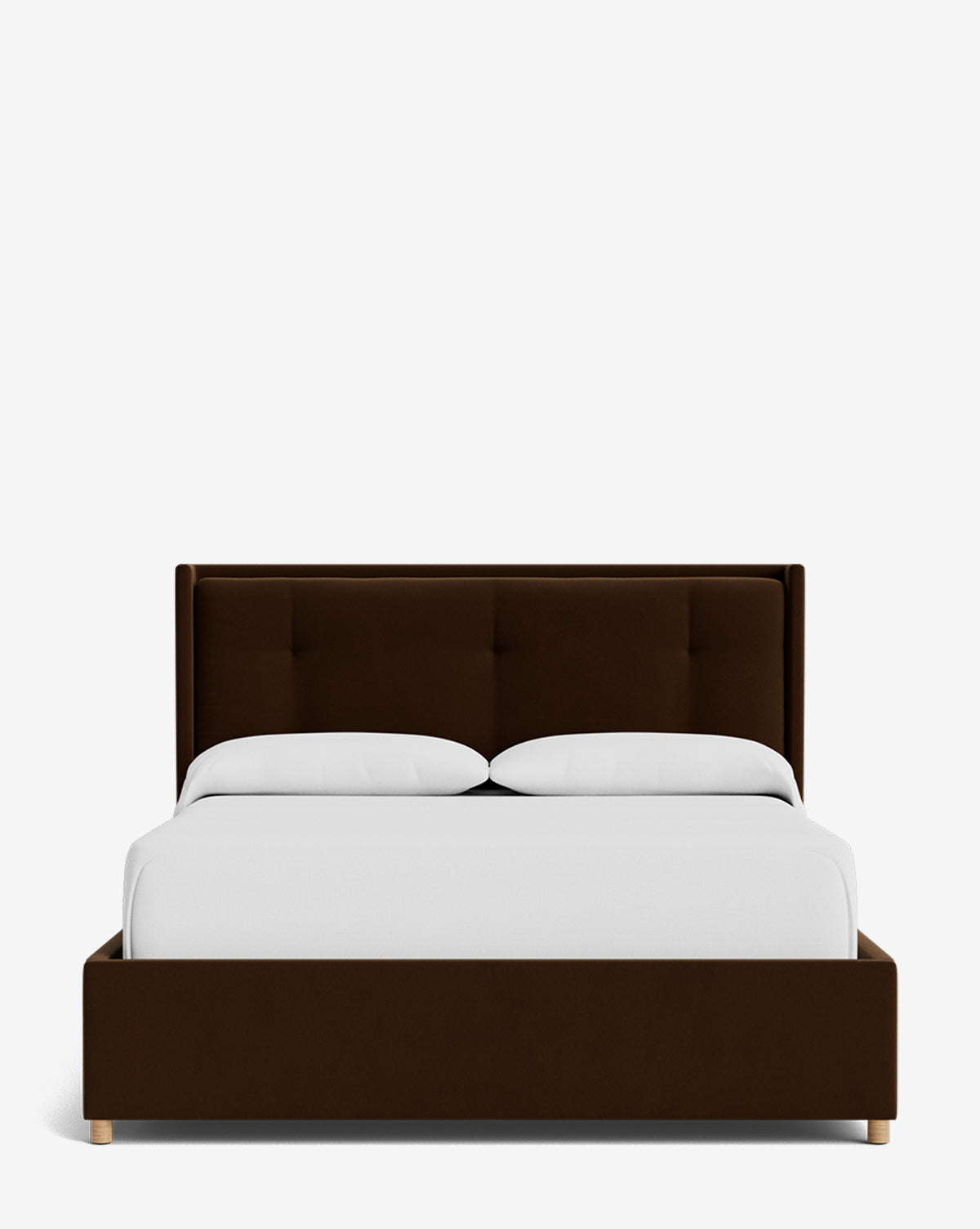 The Ria Bed Low Headboard, a modern dark brown upholstered bed with a tufted headboard, is displayed from the front with white bedding and two pillows against a plain white background by McGee & Co.