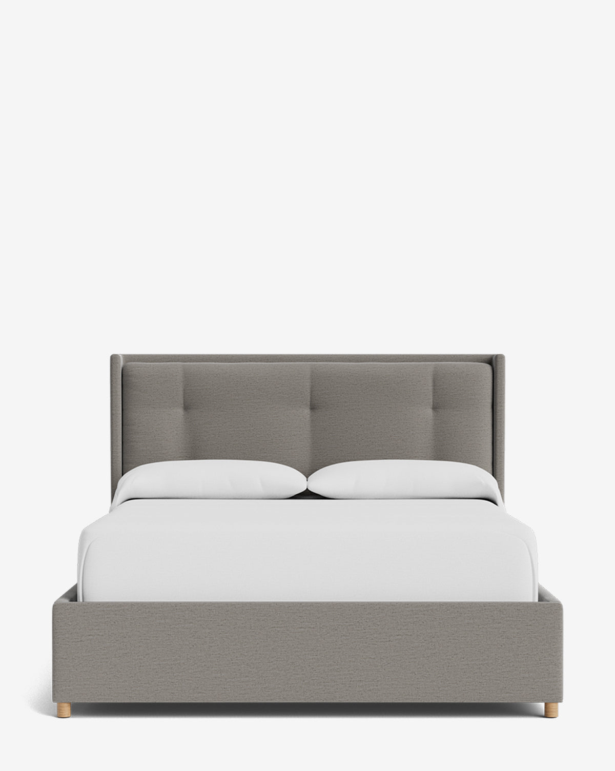 The Ria Bed Low Headboard features a modern gray tufted headboard and frame, white bedding, two pillows, and light wood legs—all set against a plain white background by McGee & Co.