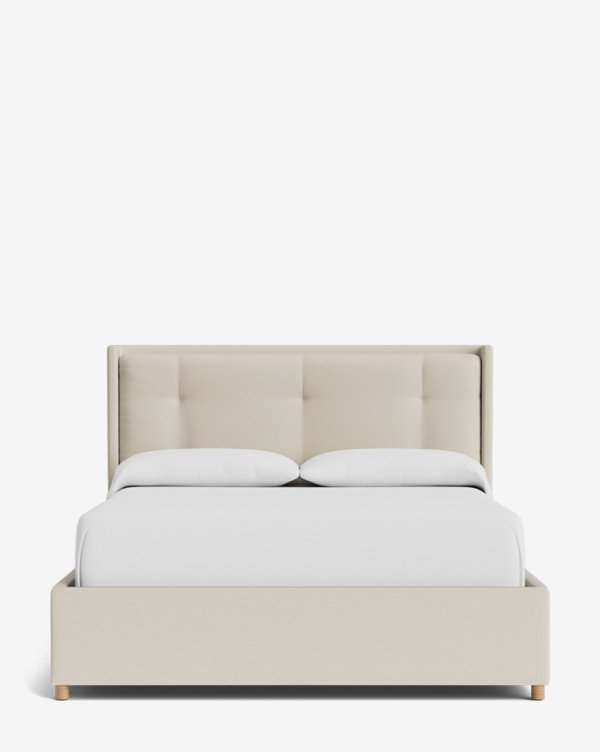 The Ria Bed Low Headboard, shown from the front against a plain white background, features beige upholstery, a modern tufted headboard, white bedding, and light wooden legs, by McGee & Co.
