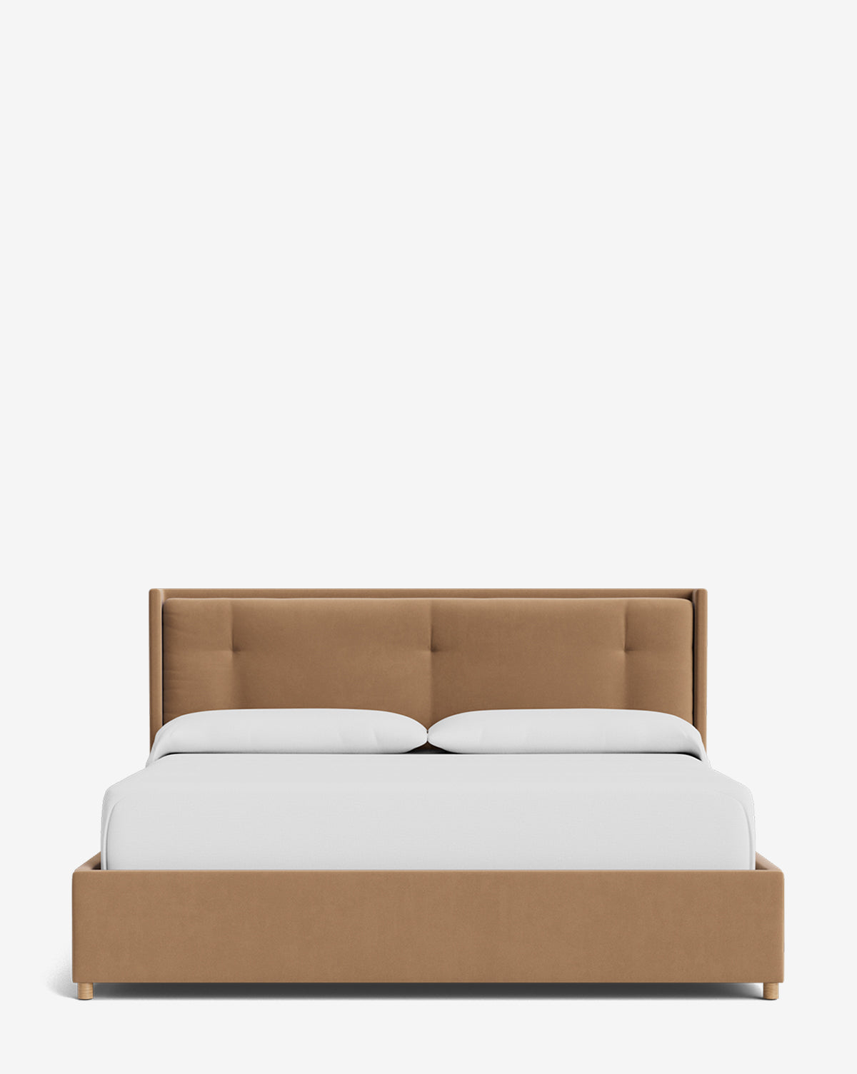 The Ria Bed Low Headboard features tan upholstery with a tufted headboard, paired with white bedding and two pillows, displayed against a plain white background by McGee & Co.