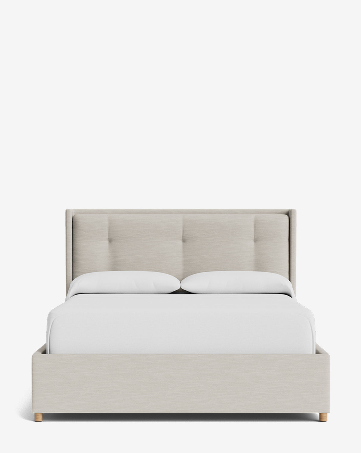 The Ria Bed Low Headboard features modern beige upholstery, wooden legs, and is styled with white bedding and pillows, all set against a plain white background by McGee & Co.