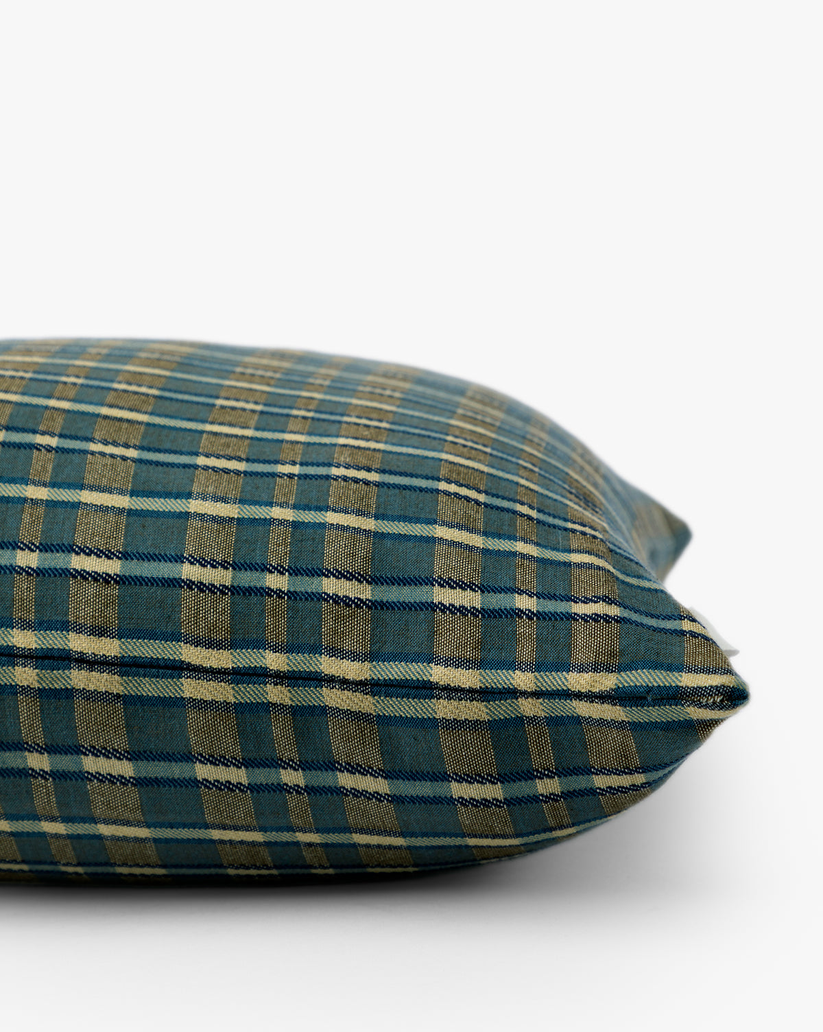 A close-up of the Selwyn Plaid Pillow Cover showcases its blue and beige heritage-inspired pattern on fabric, displayed against a plain white background, by McGee & Co.