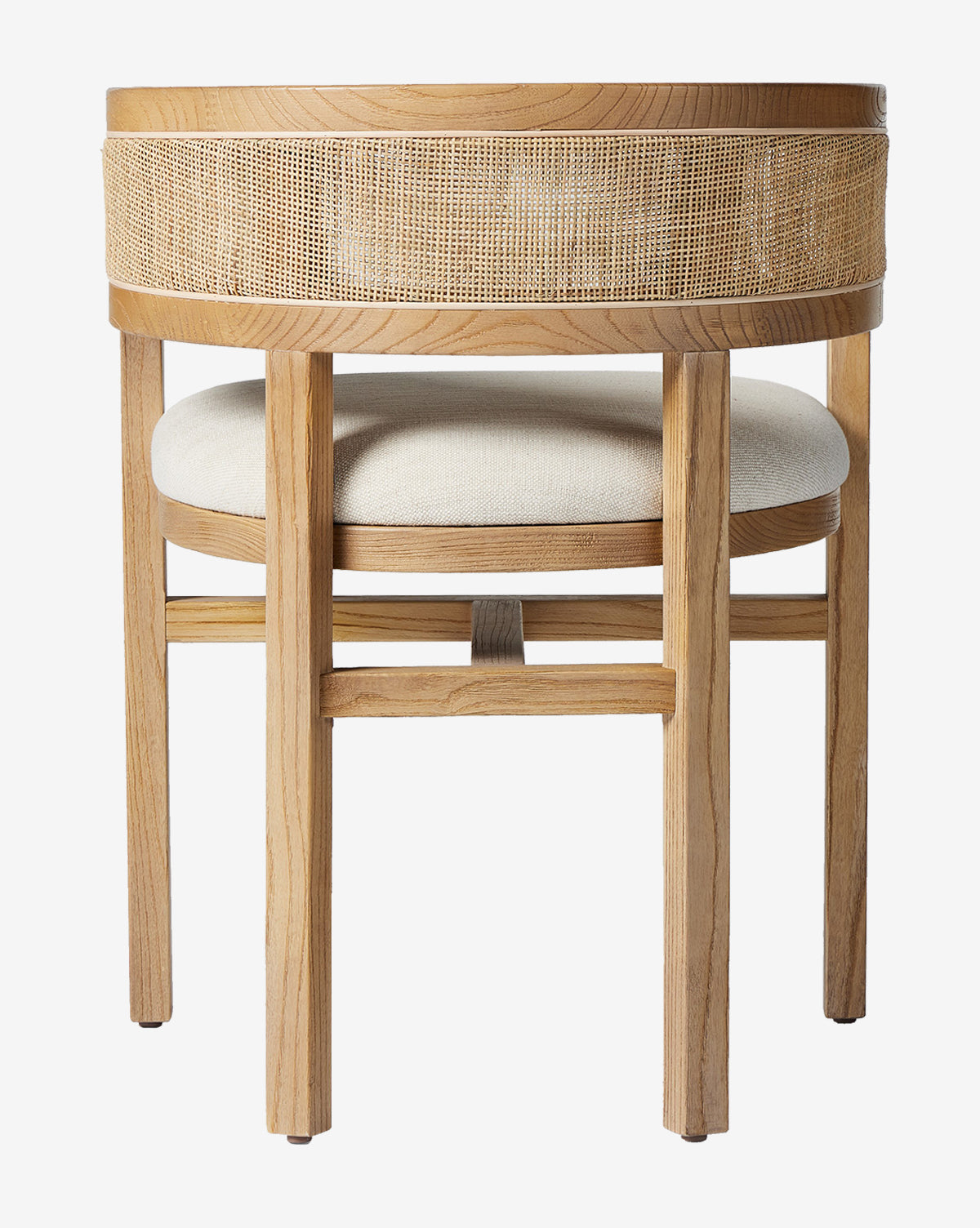 The Valissa Dining Armchair features a modern wooden frame, round cane seatback, and light beige cushioned seat—an elegant choice for contemporary spaces, shown from the back by McGee & Co.