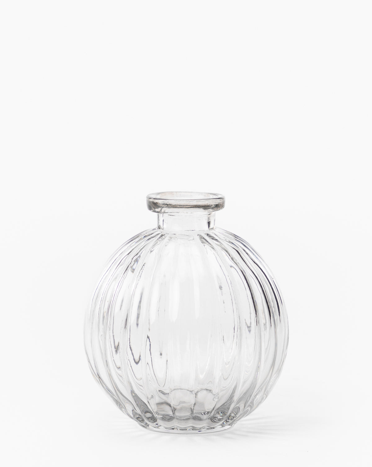 The Verlice Glass Round Vase features mouth-blown glass with a vertical ribbed texture and a small, short neck—ideal for decorative vignettes. Shown against a plain white background.