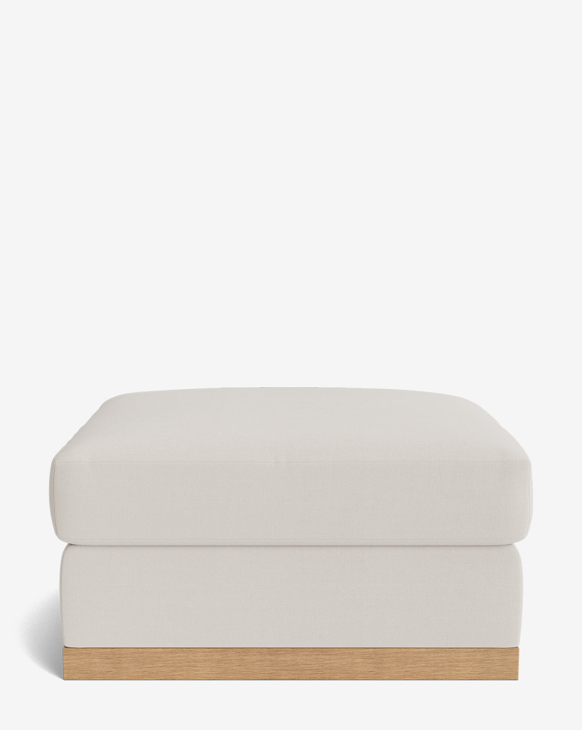The Vernon Modular Ottoman features a modern rectangular design with light beige velvet upholstery and a simple wooden base, shown against a plain white background by McGee & Co.
