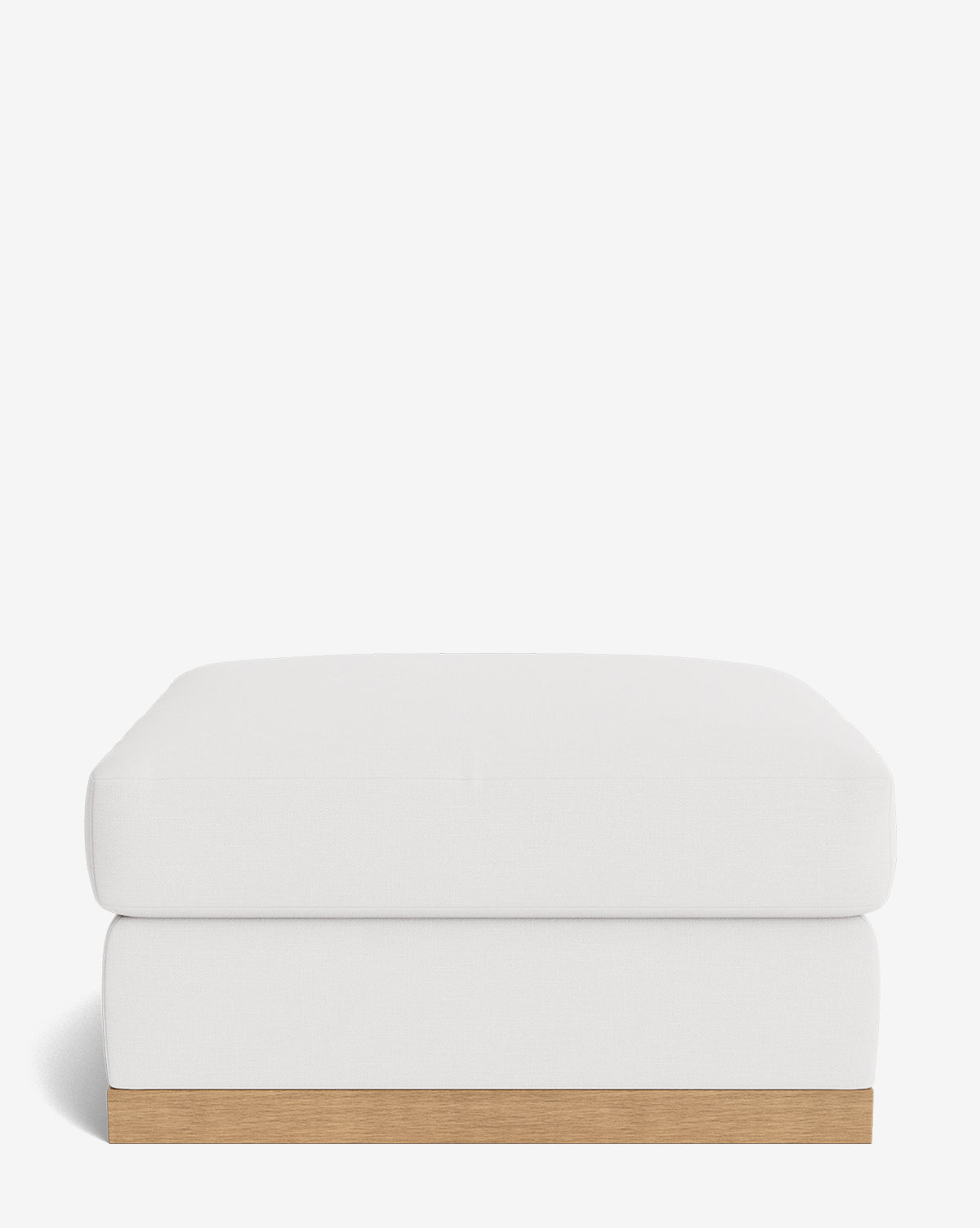 The Vernon Modular Ottoman features a modern white down-wrapped rectangular cushion atop a light wood base, displayed against a plain white background, by McGee & Co.