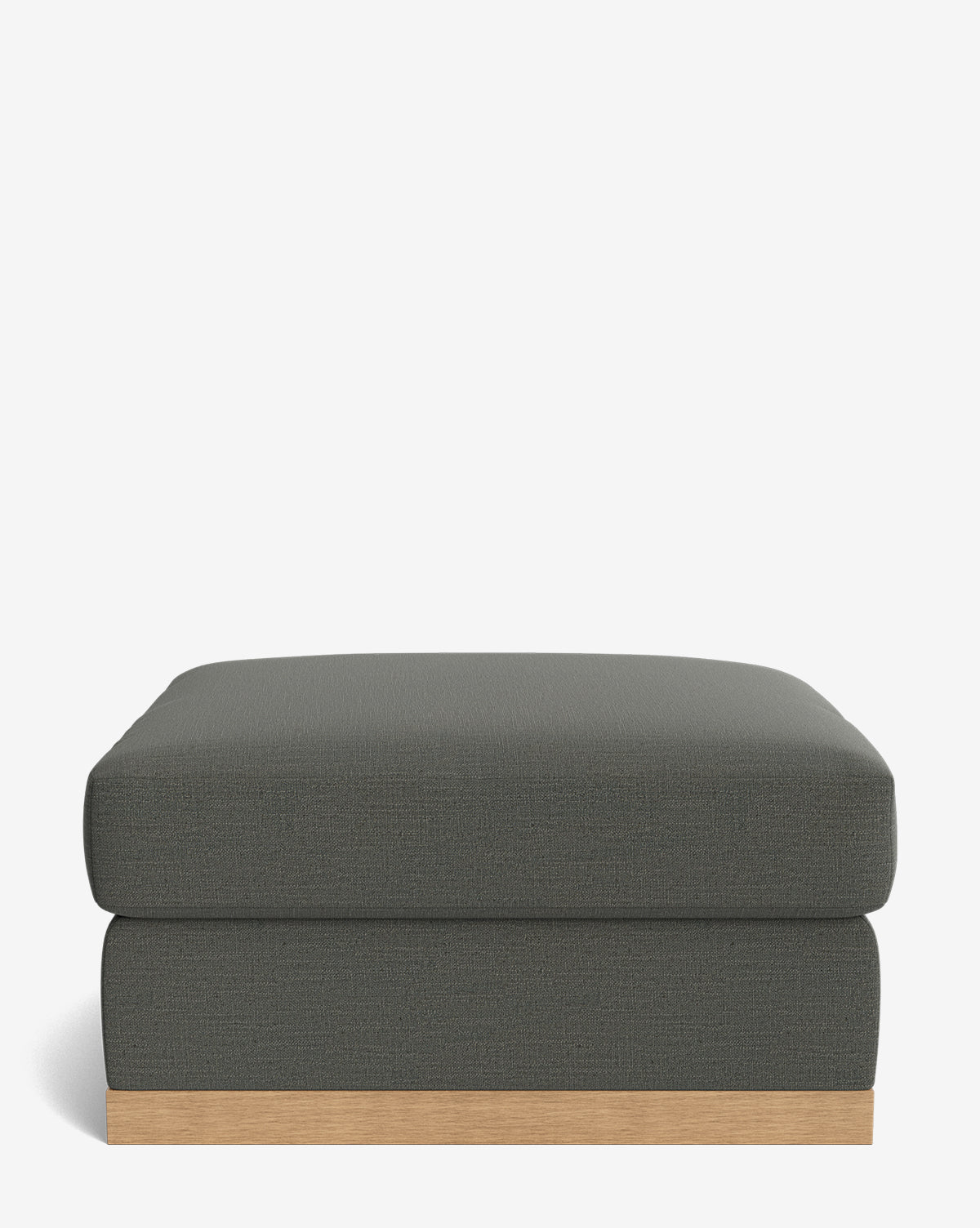 The Vernon Modular Ottoman features a modern square design, upholstered in dark gray fabric with a wooden base, shown against a plain white background, by McGee & Co.