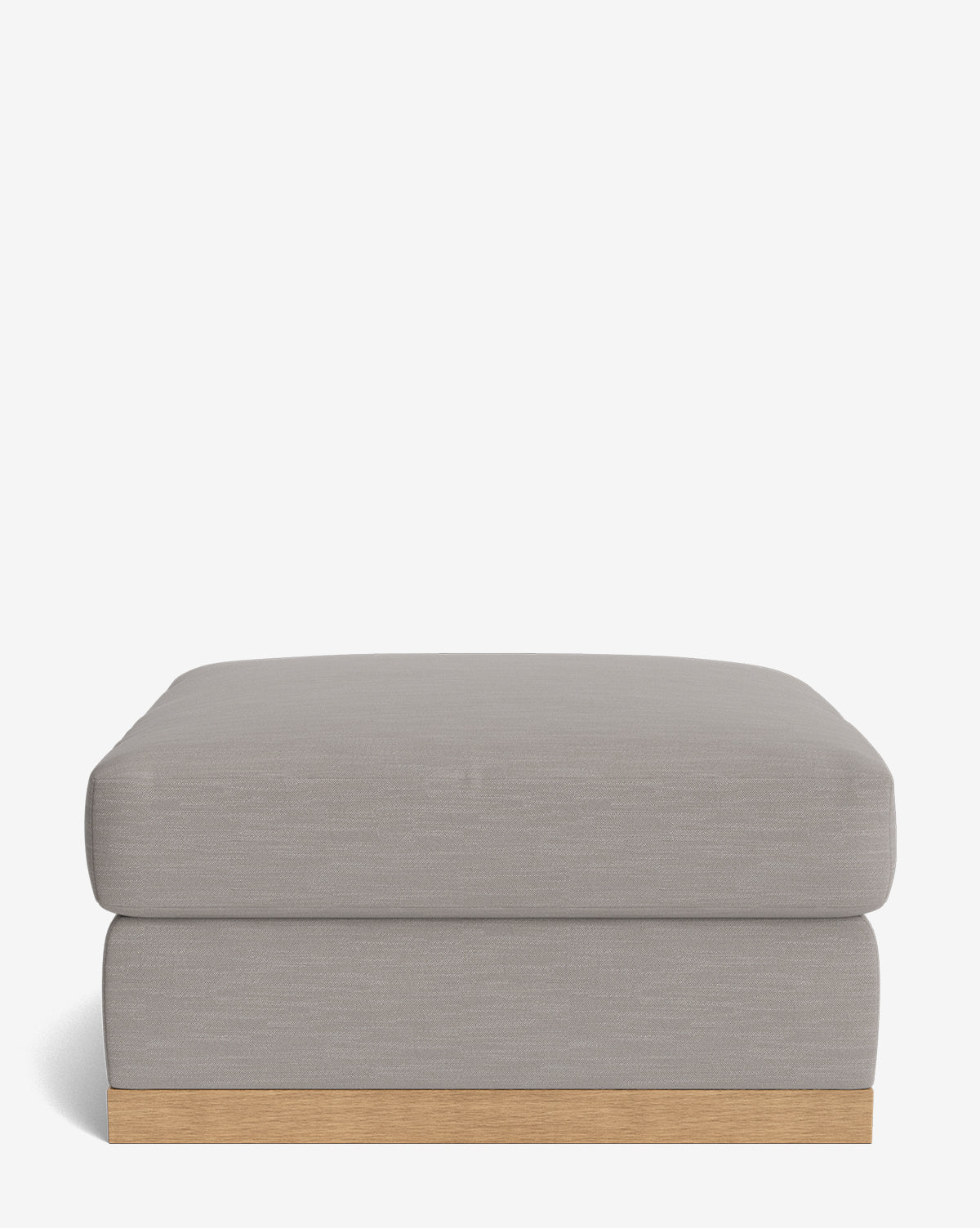 The Vernon Modular Ottoman features a modern rectangular design with light gray upholstery and a low wooden base, shown against a plain white background, by McGee & Co.