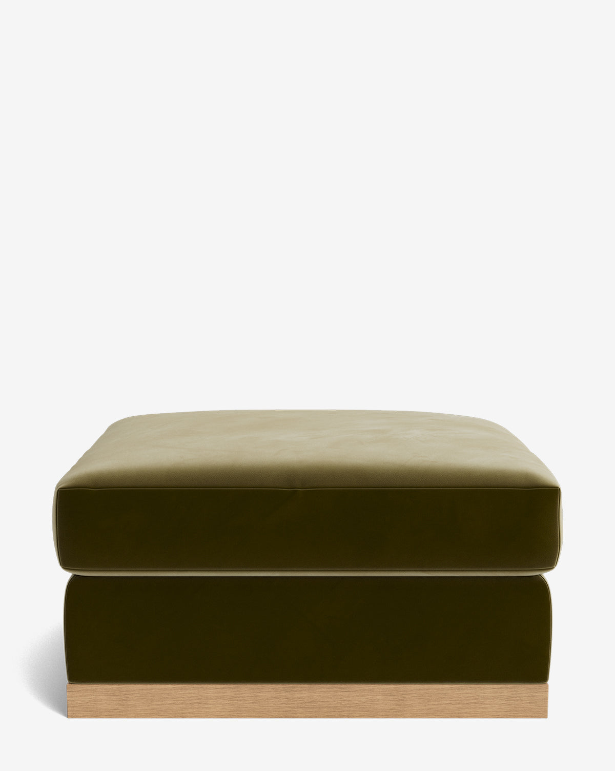 The Vernon Modular Ottoman is a square, olive green velvet piece with a plush cushion top and a light wooden base, displayed against a plain white background by McGee & Co.