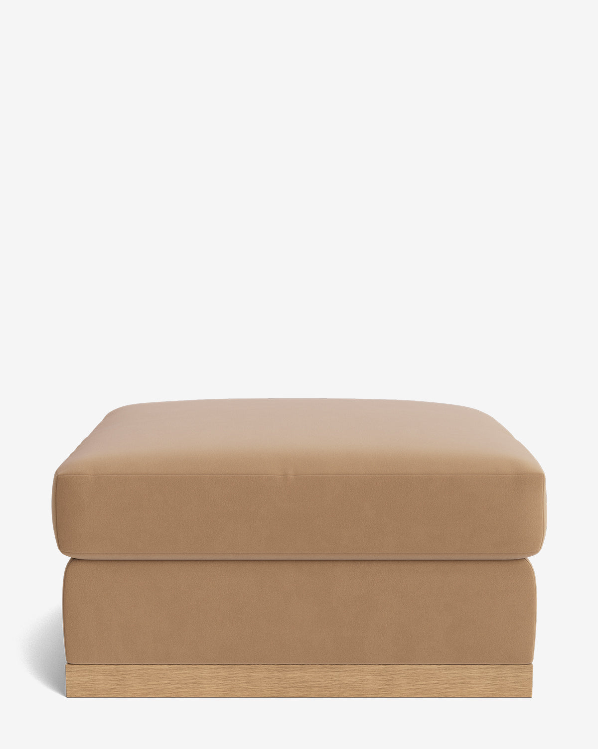 The Vernon Modular Ottoman is a tan, rectangular velvet piece with a cushioned top and wooden base, displayed against a plain white background, by McGee & Co.