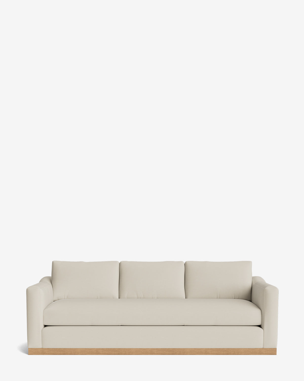 The Vernon Sofa 92 is a modern, cream-colored sofa with three seat and back cushions, rounded armrests, and a light alder wood frame, shown against a plain white background by McGee & Co.
